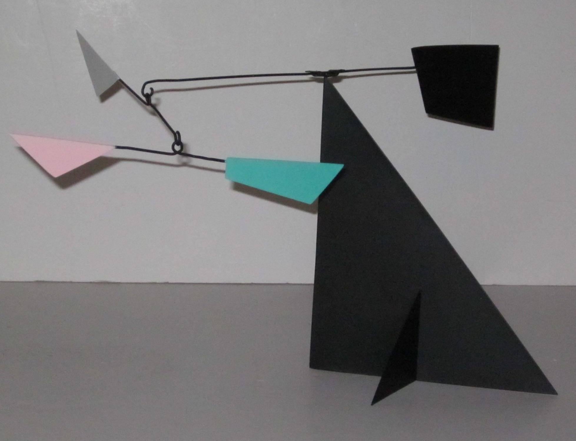 Abstract decorative mobile sculpture in the style of French artist Mario Conti.
Pink, white and turq color accents on a black base.
Measurements: 21 L x 9 W x 10 H base is 9 x 6.
