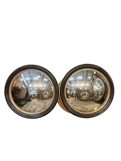 Grand miroir rond convexe italien des années 1920, laqué noir et orné de dorures à la feuille