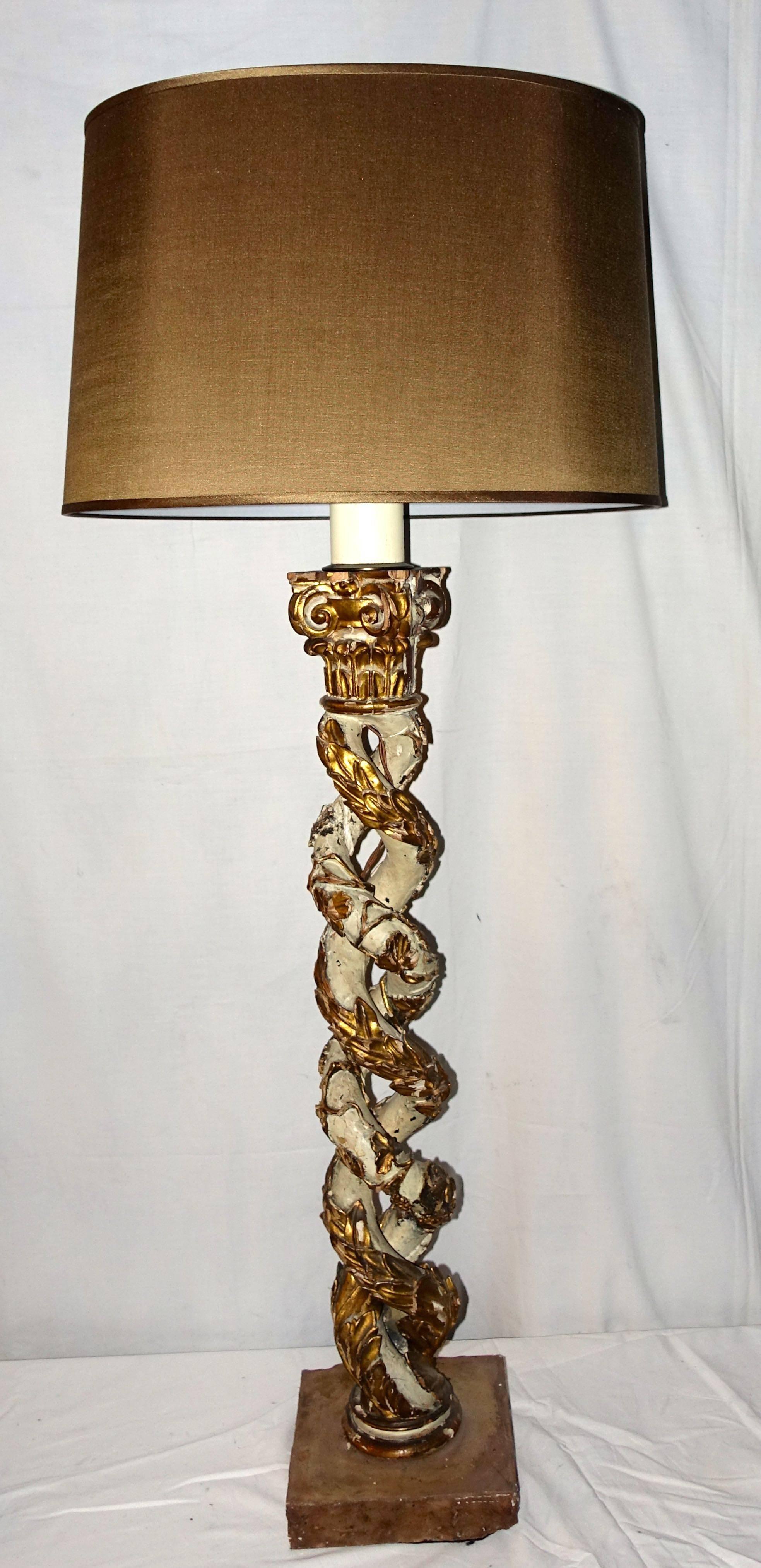 Decorative twisted, carved wood columns with gold gilt capitals originally found on cathedral altar.
Converted to a lamp with oval silk shade.
Newly rewired.
Measures:
Overall height is 47