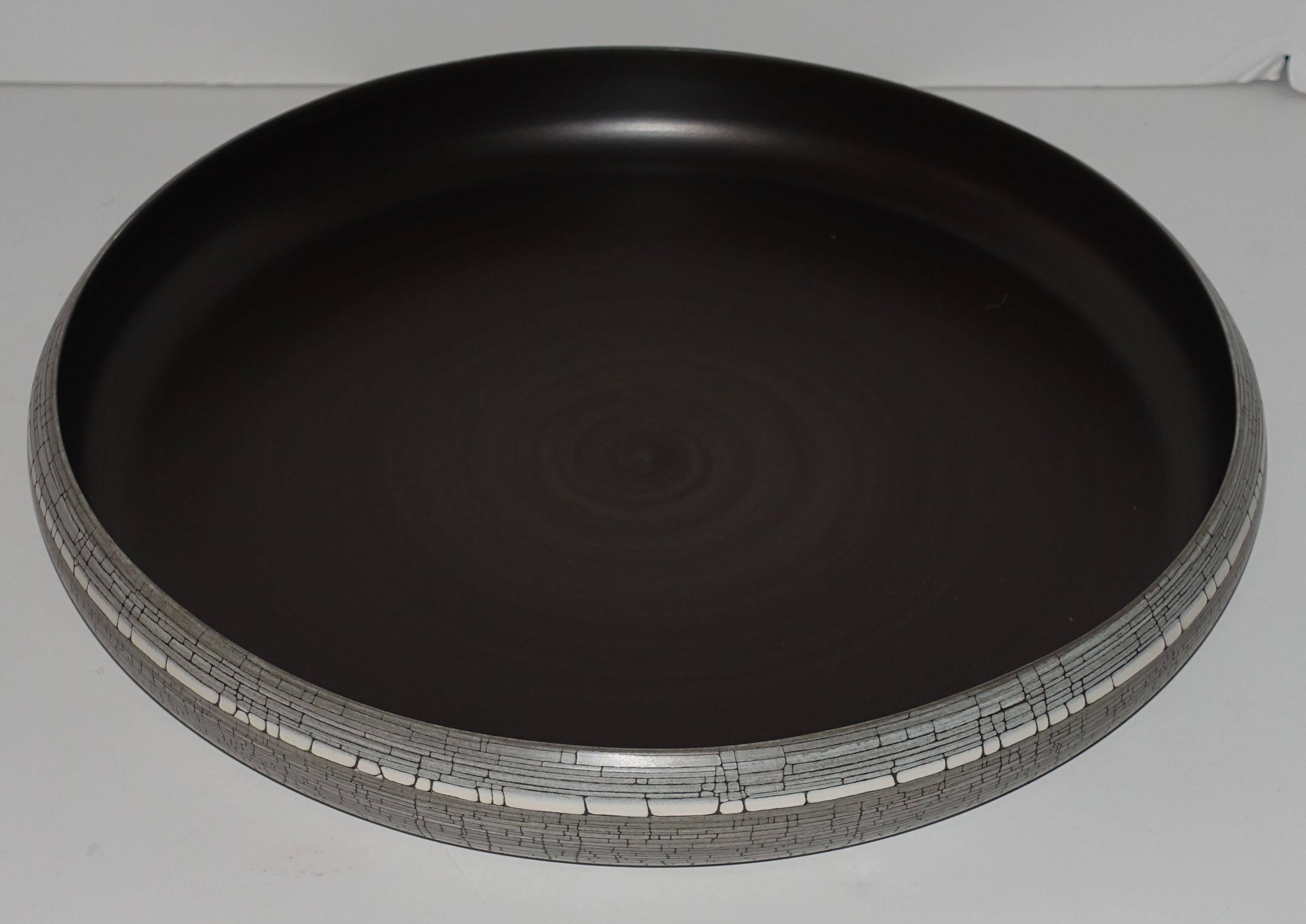 Contemporary Italian handcrafted fine ceramic bowl.
Exterior has a birch motif, interior is dark bronze.
Food safe.

