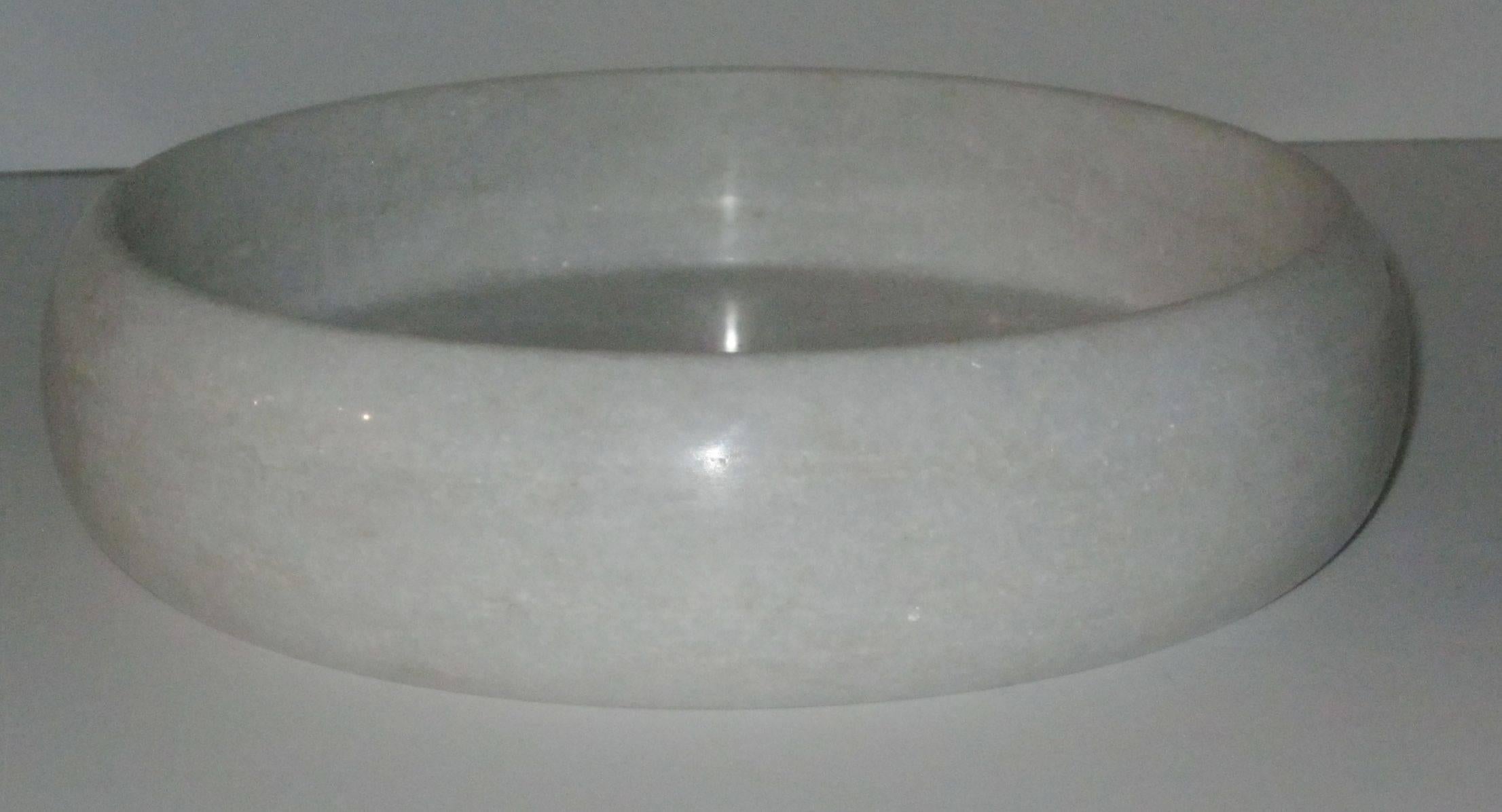 Contemporary Indian round marble tray with high sides.

 