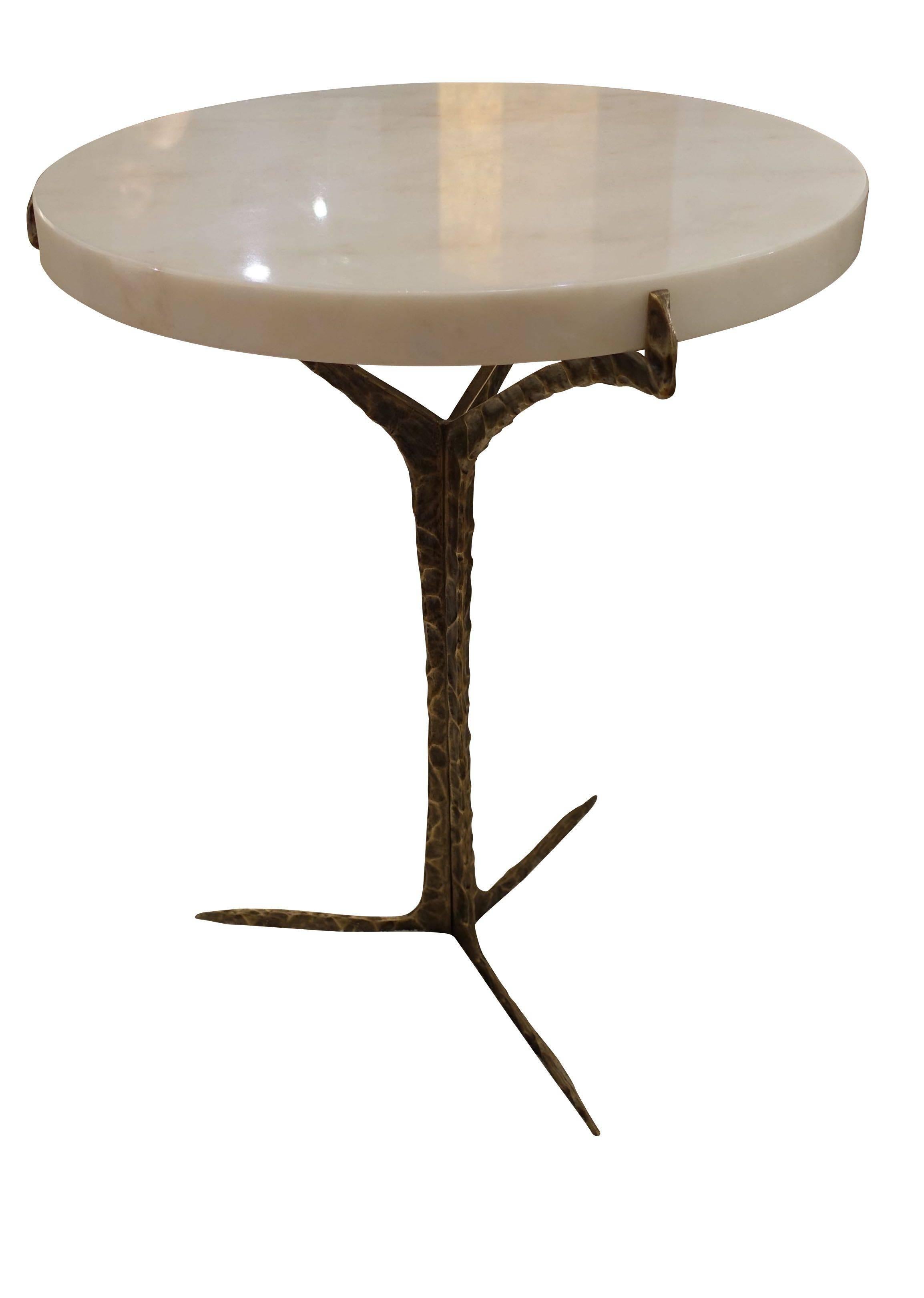 Contemporary Portuguese cocktail table.
Round Estremoz marble-top, hammered aged brass feet.
 
