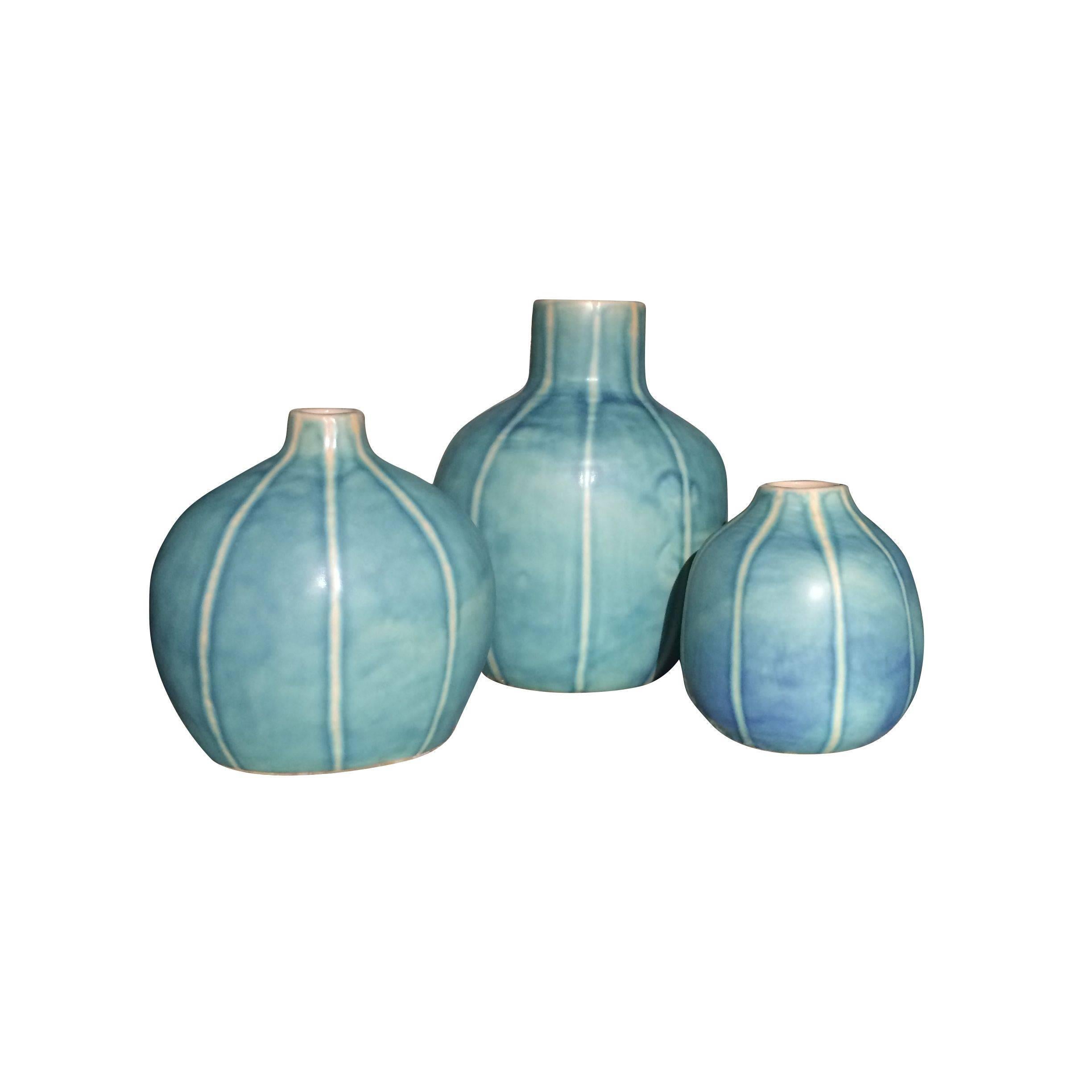 Contemporary medium sized melon shaped washed turquoise glazed stoneware vase.
Sits well with S4646 and S4647.
See image #2.
  