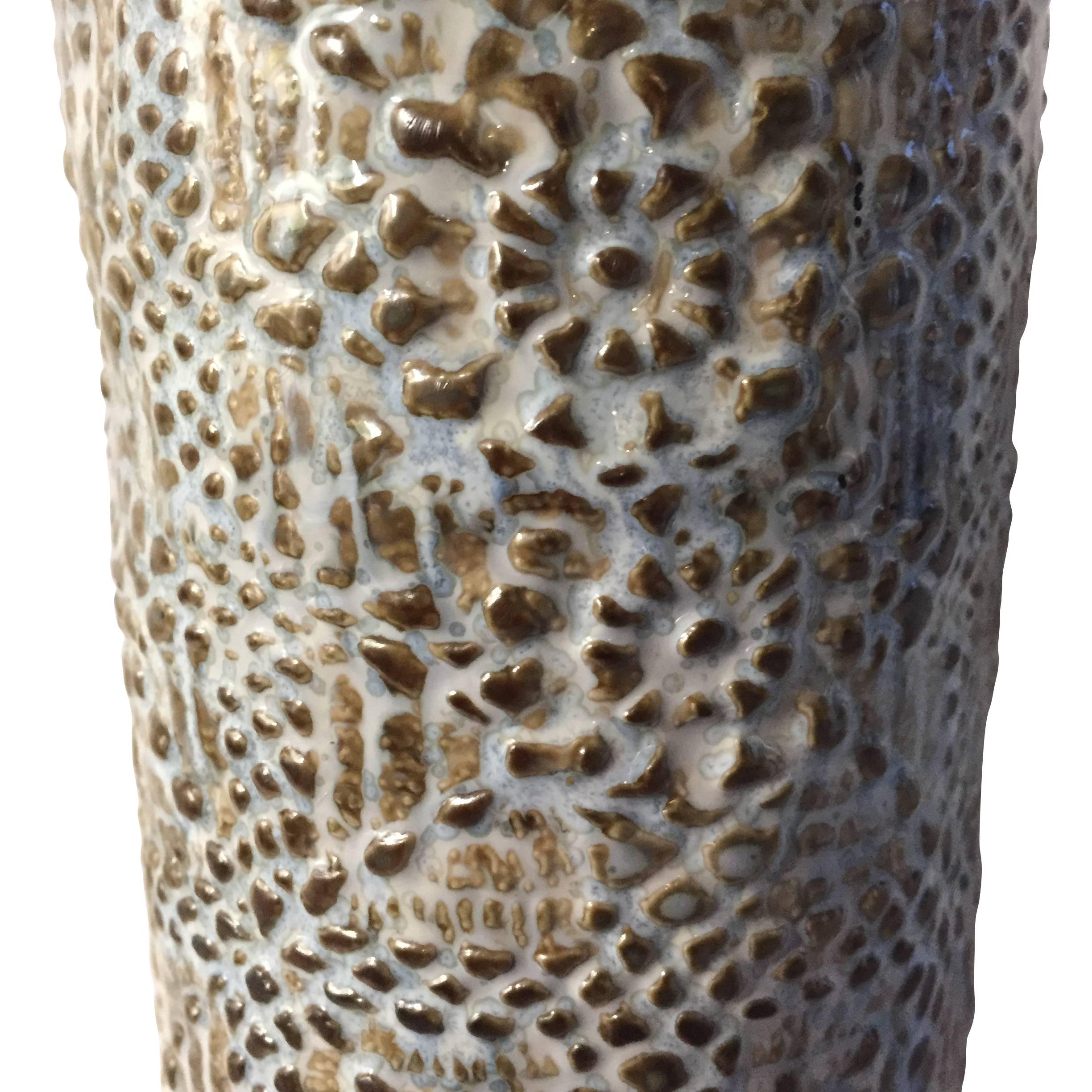 Contemporary textured tall thin vase vintage inspired design.
Floral motif pattern.
    