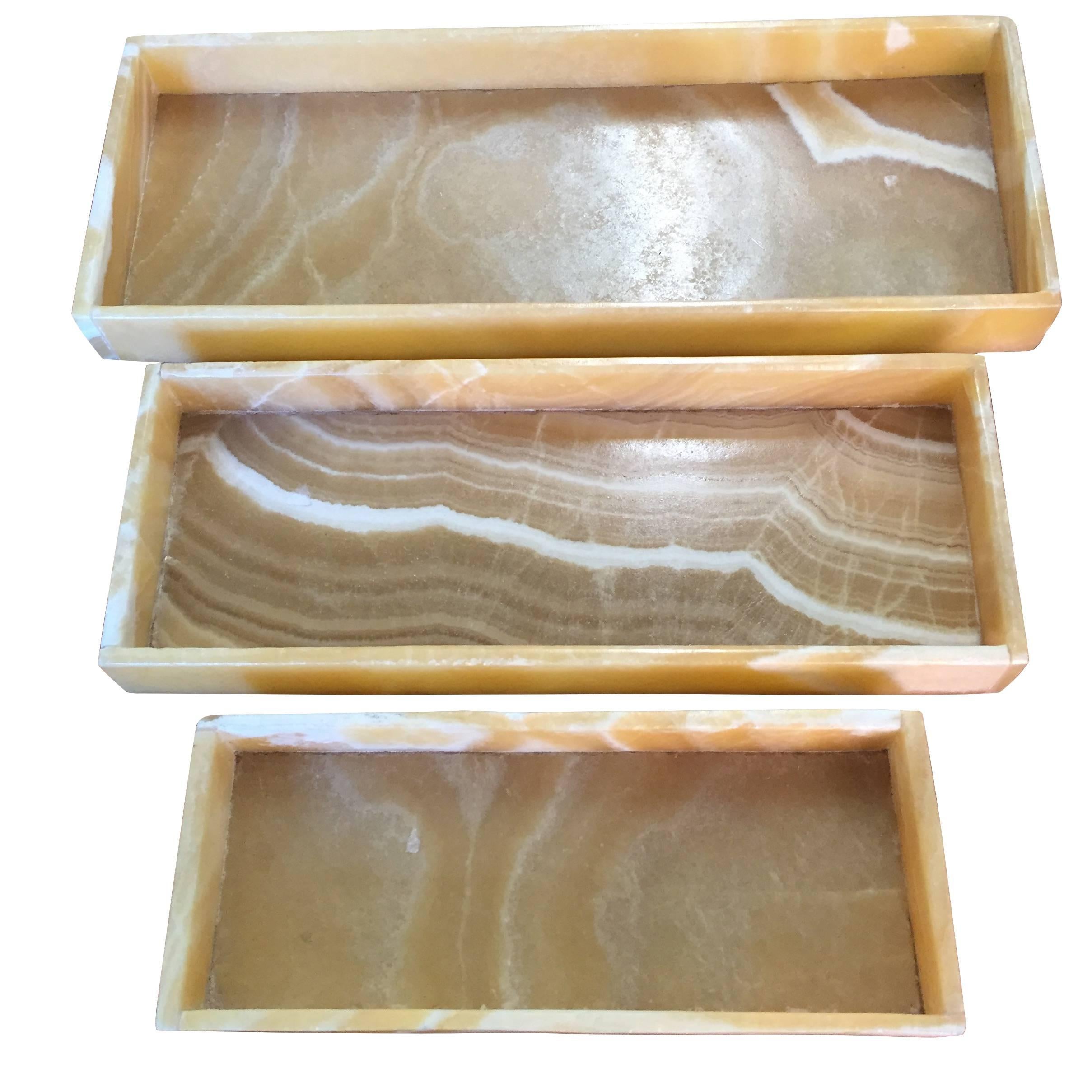 Contemporary set of three onyx trays that fit within each.

Large        12