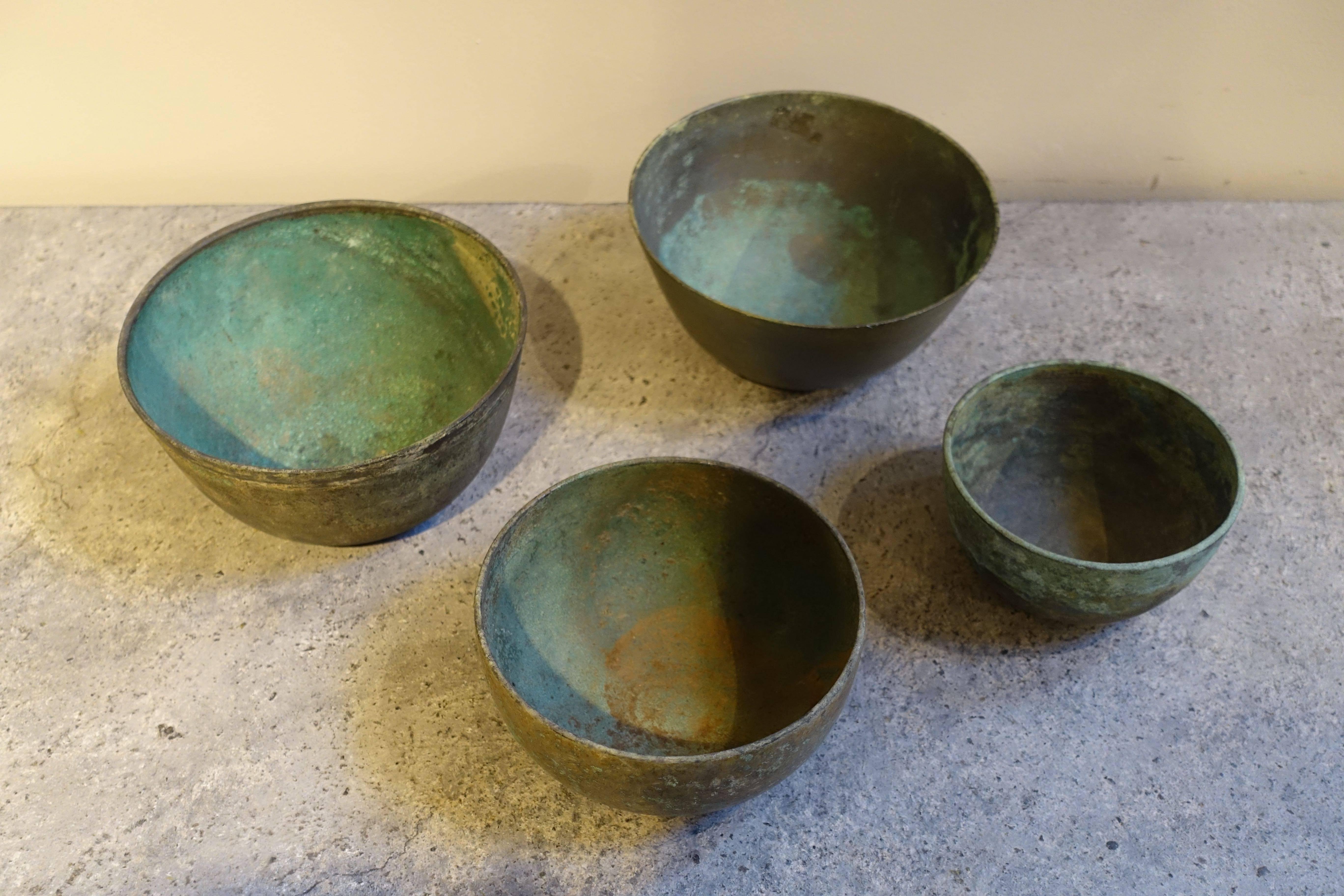 18th century from Khmer people of Cambodia bronze bowls.
Two sizes available
S4701  6.5 inches diameter x  4 inches tall $795 each
S4702   4.75 inches to 5.5 inches diameter x 2.75 to 3 inches tall  $775 each.