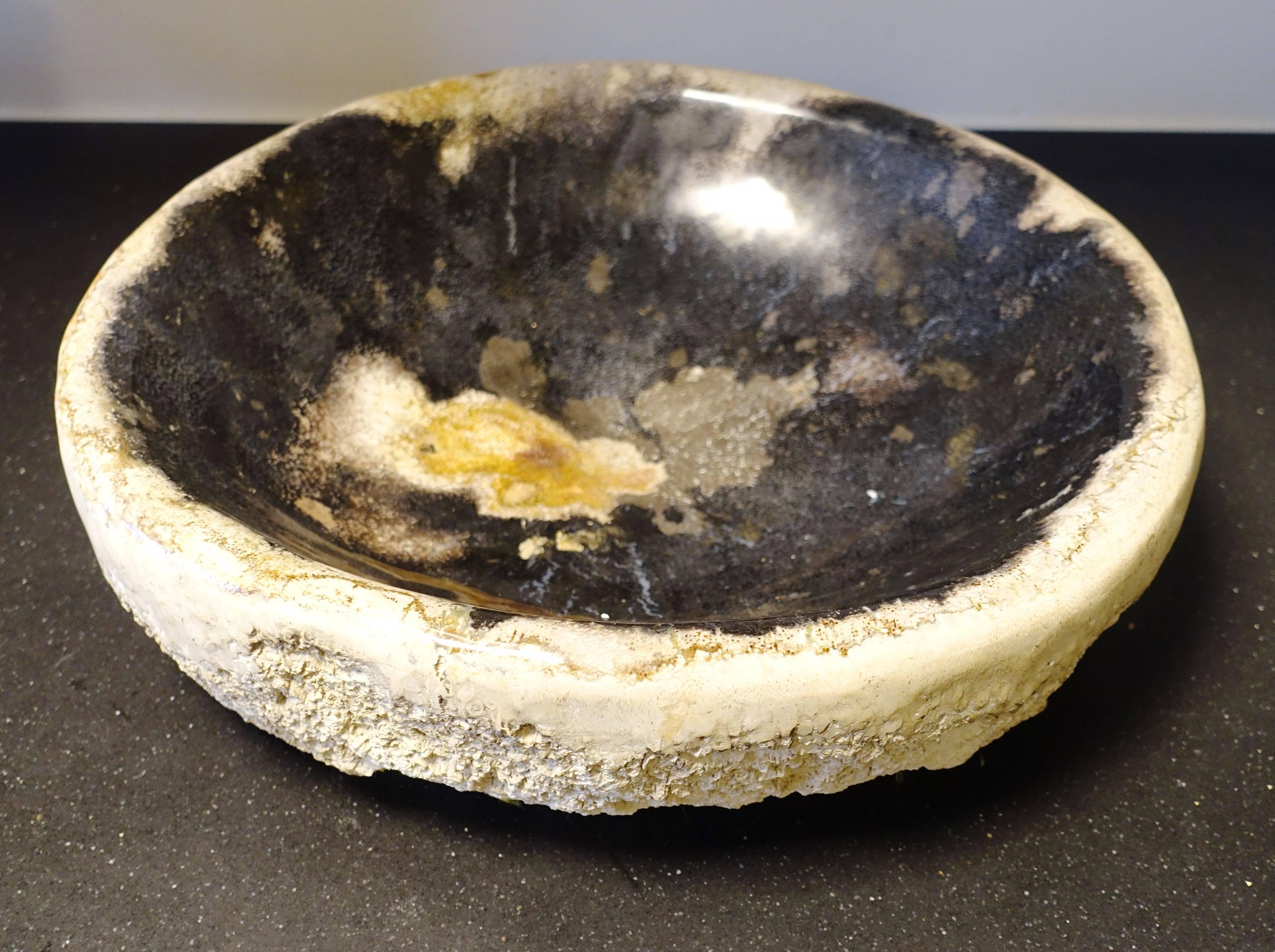 Indonesian XL round petrified wood bowl.
Polished finish, textured sides.
  