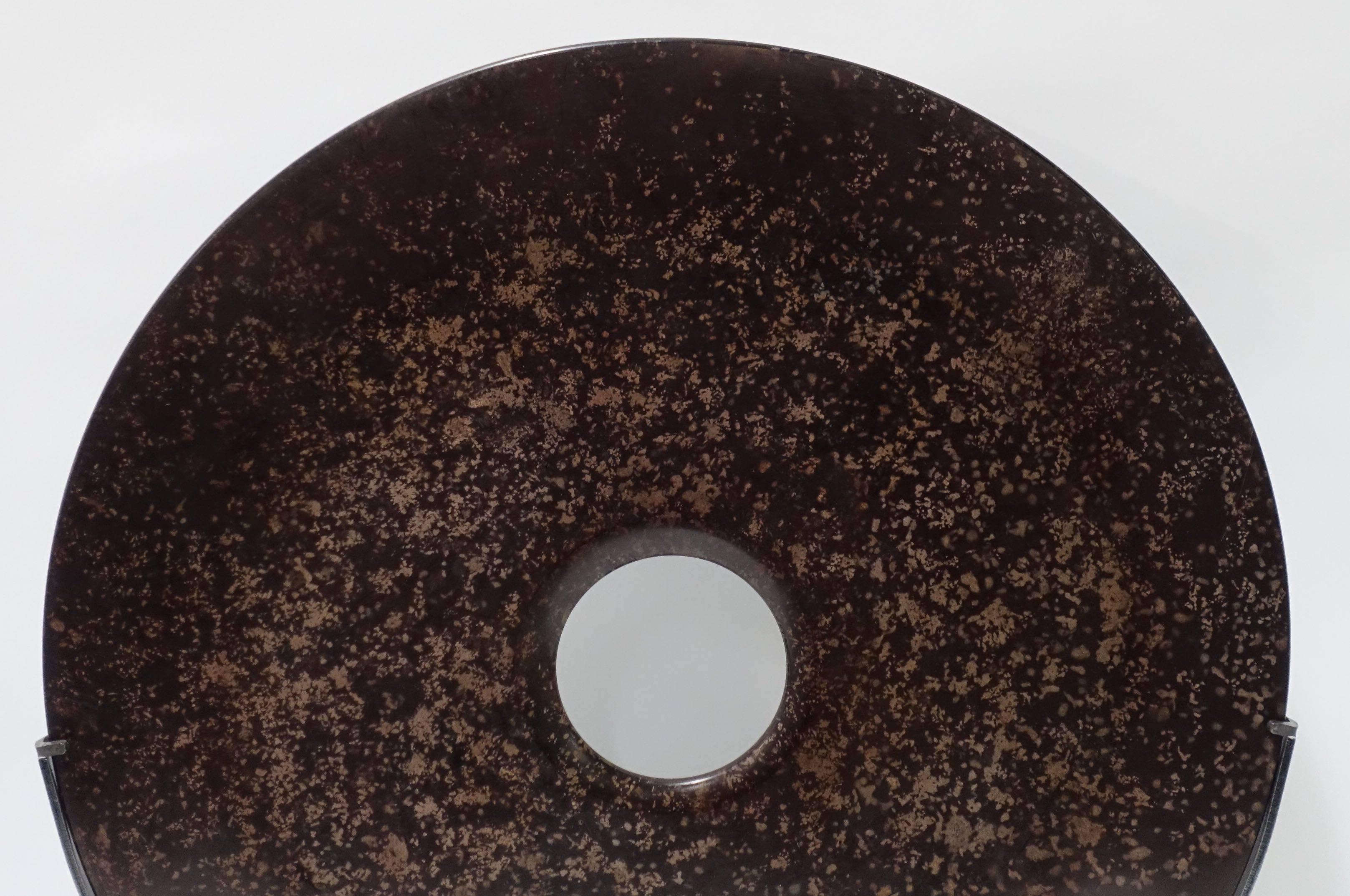 Contemporary Chinese two brown polished stone discs on stands.
Measures: The large is smooth and speckled in color 16
