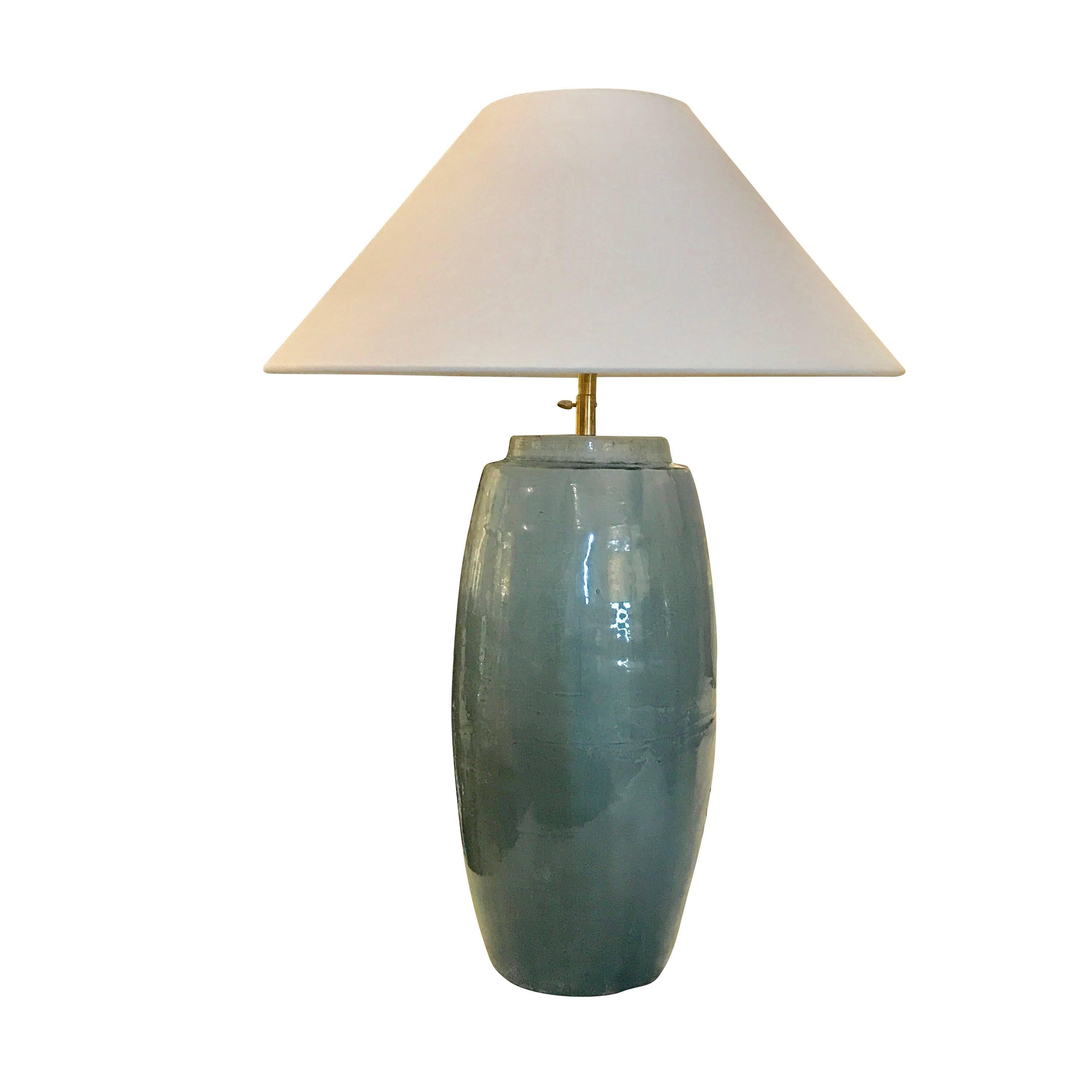 Contemporary Chinese pair cylinder shaped washed turquoise glazed lamps.
New linen shades.
Newly wired.
Fixture height without shade is 24.5