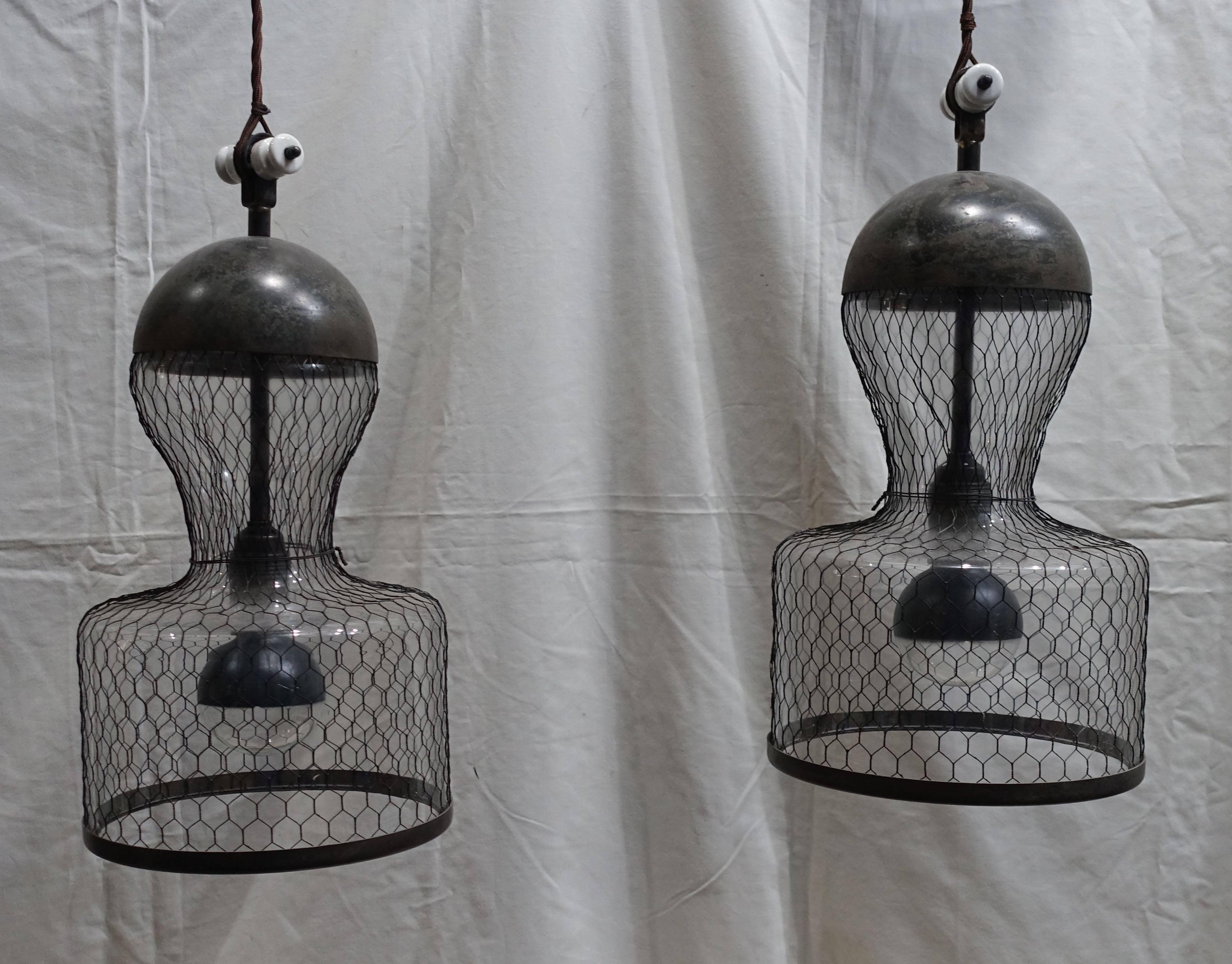 Unusual pair of mesh covered glass Industrial lights from Italy. Note the special design details on the top of the glass fixtures. They are made from vintage parts. The lights are wired for the U.S.