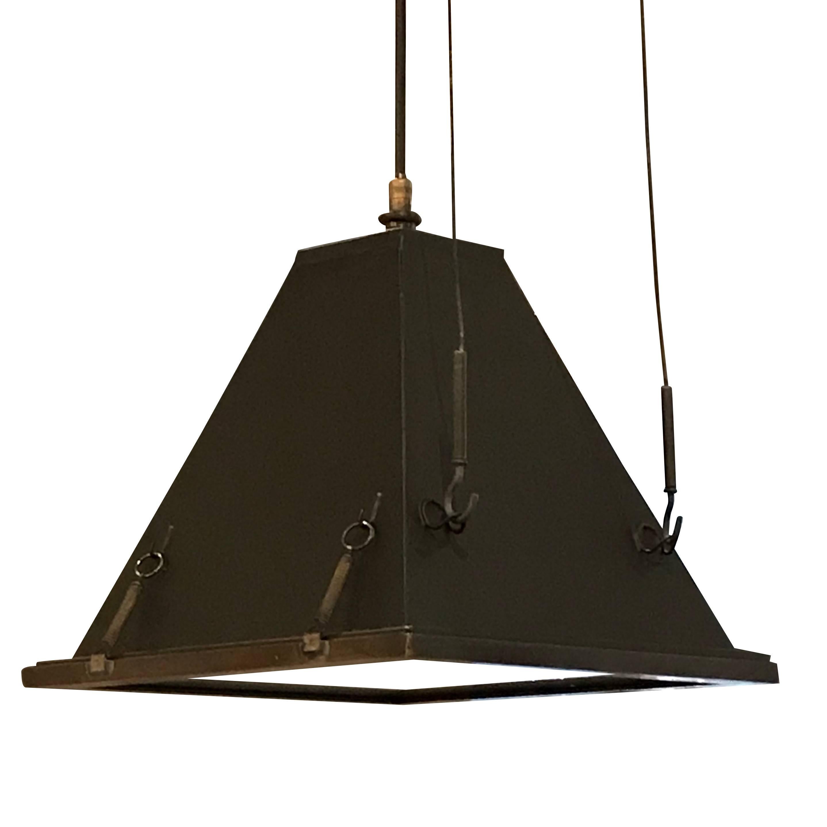 Mid century Italian pair pyramid shaped black steel industrial lights with brass trim detailing.
Adjustable metal hanging supports.
Originally housed in an Italian film factory.
Height of 10" is the fixture itself.
Overall height is 46" (