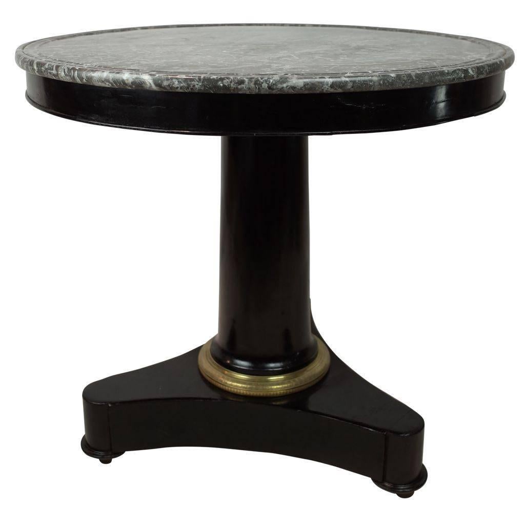 19th century French ebony gueridon with grey marble top.
Brass band details.
Classic design.
Arriving August.