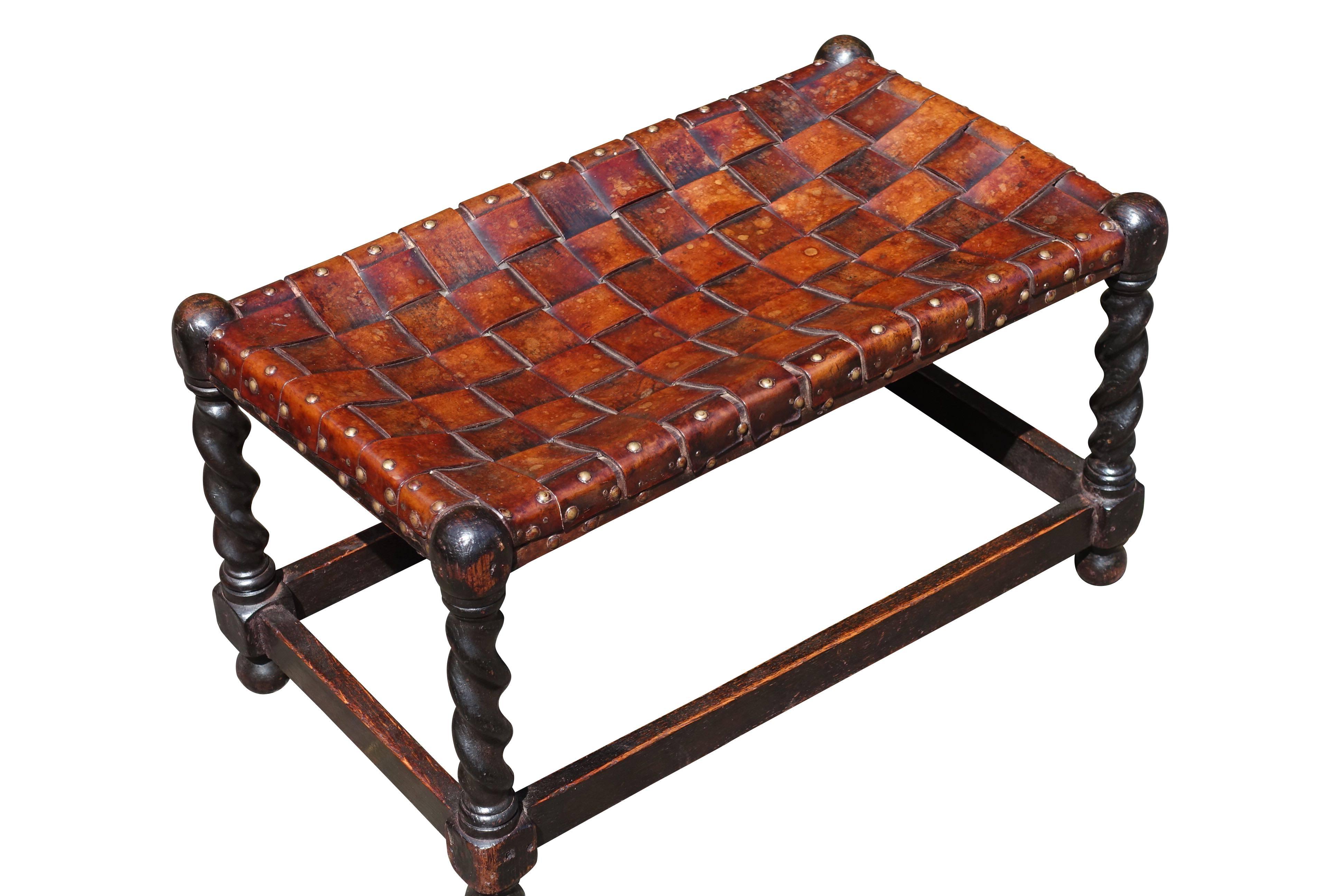 English Classic woven leather foot stool, circa 1860
Walnut with brass tacks.
