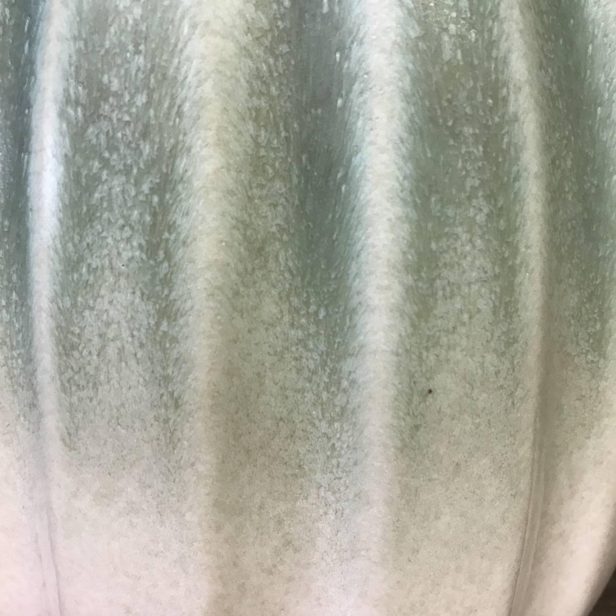Melon shaped design vase.
Ombre glaze of pale sea foam and cream.