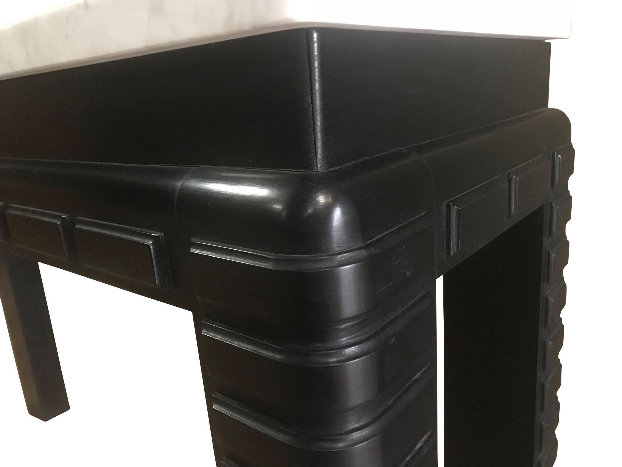 1930s, French ebonized mahogany base with decorative legs console table.
Thick Italian white carrara marble top.
