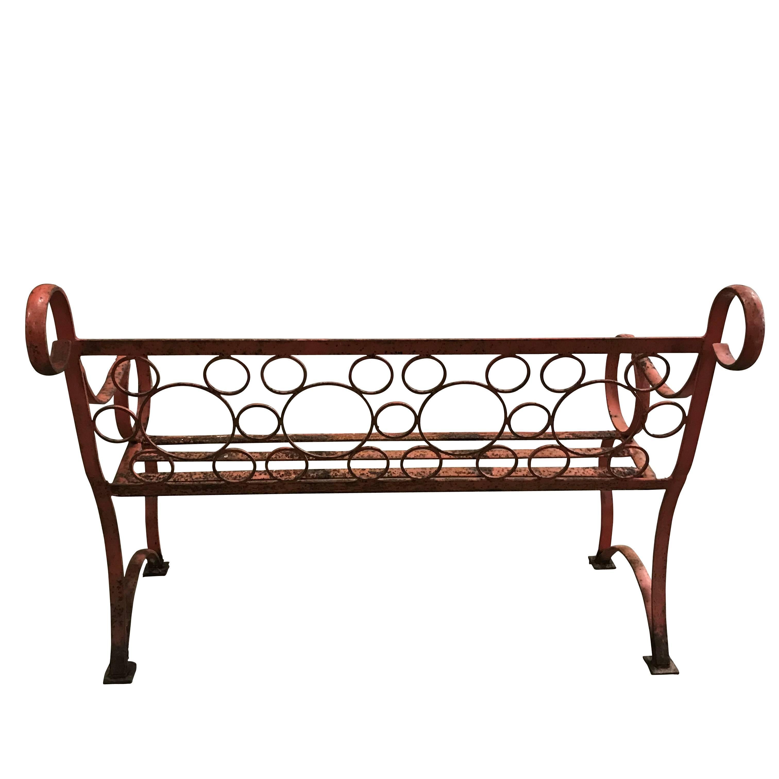 1940s English naturally weathered orange iron garden bench.
Unique and unusual varying sized circles as pattern for back of bench.
Whimsical and very decorative.
