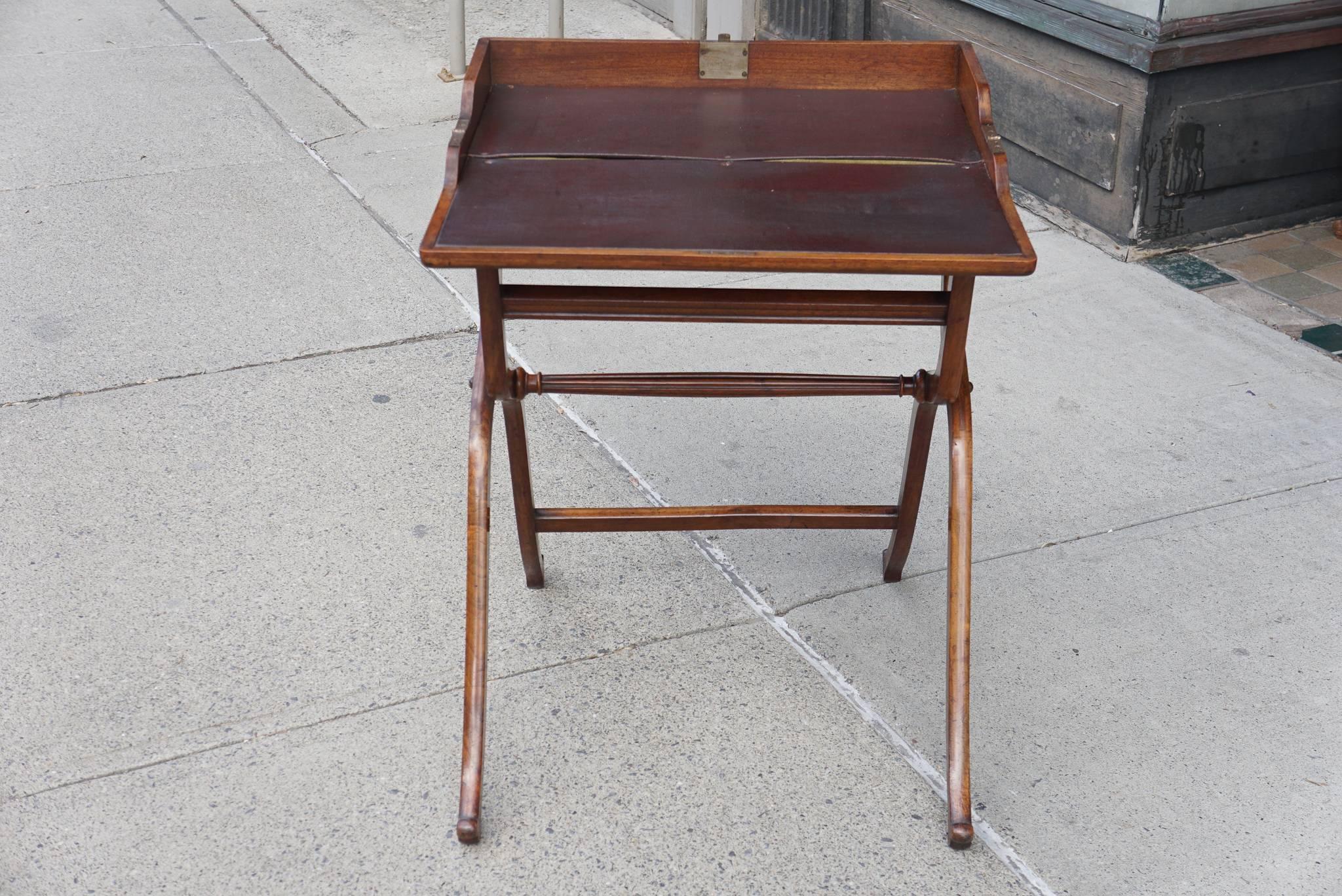 This mahogany campaign desk is designed to fold in half lock and contain papers and work while travelling. Excellent in today's interiors as an end table or bed side table. The mahogany timber is well selected with long grain boards for strength.