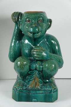 Two Companion Glazed Terra Cotta Monkeys
