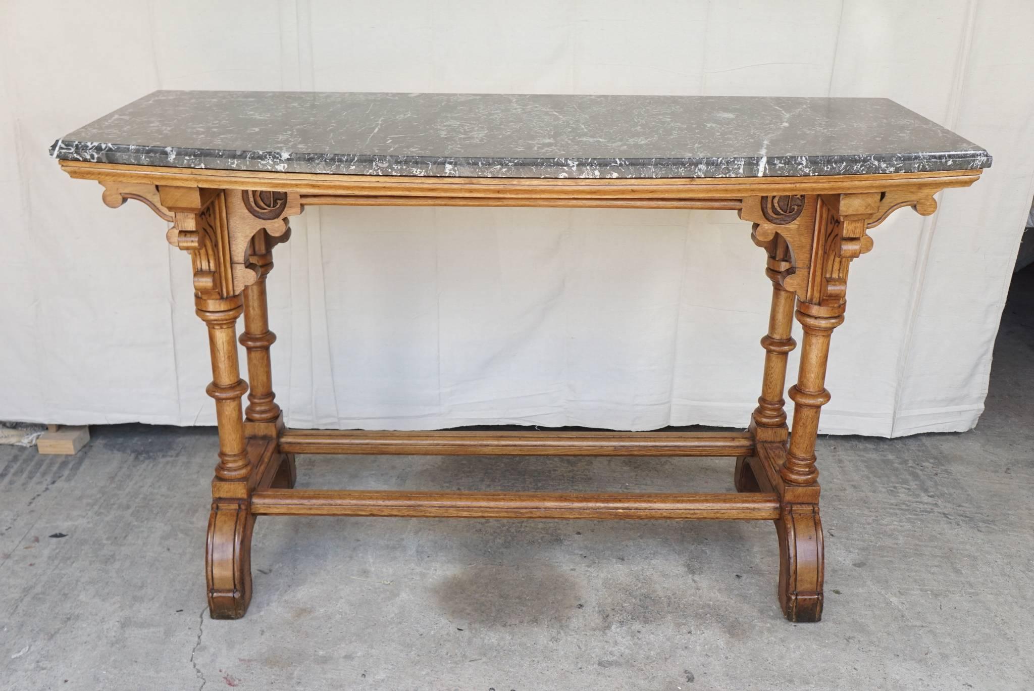 This pair of tables made in England, circa 1870 are from fine and heavy English oak. Parts are carved and incised while other elements are turned. This creates a sense of lightness with an overall airy upward movement. While not architectural like