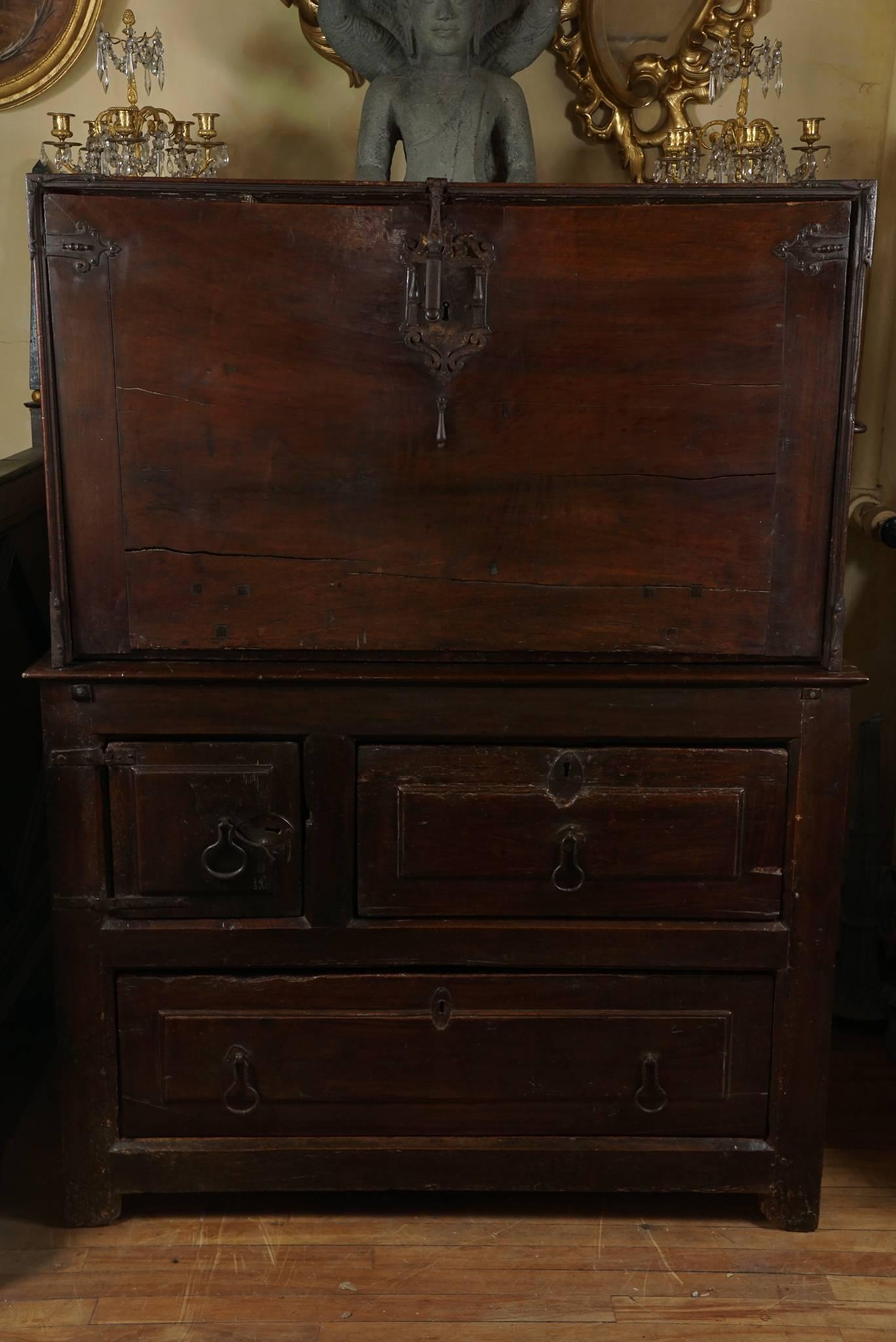 This interesting two-part piece of furniture is an example of the Spanish dominion over the Americas during the global colonization associated with Empire and trade supremacy. The top is an 18th-century walnut Vargueno is of Spanish Colonial origin