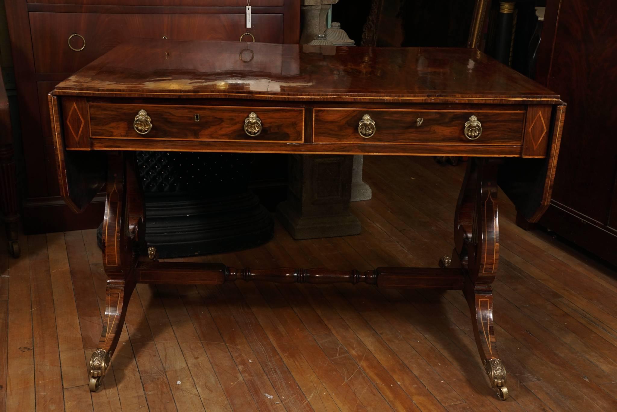 This period sofa table is a fine example of furniture made in the classical taste. Constructed in circa 1815 the table has good wood grain patterns showing the care taken in craftsmanship by the maker. Selected to create a book matched pattern