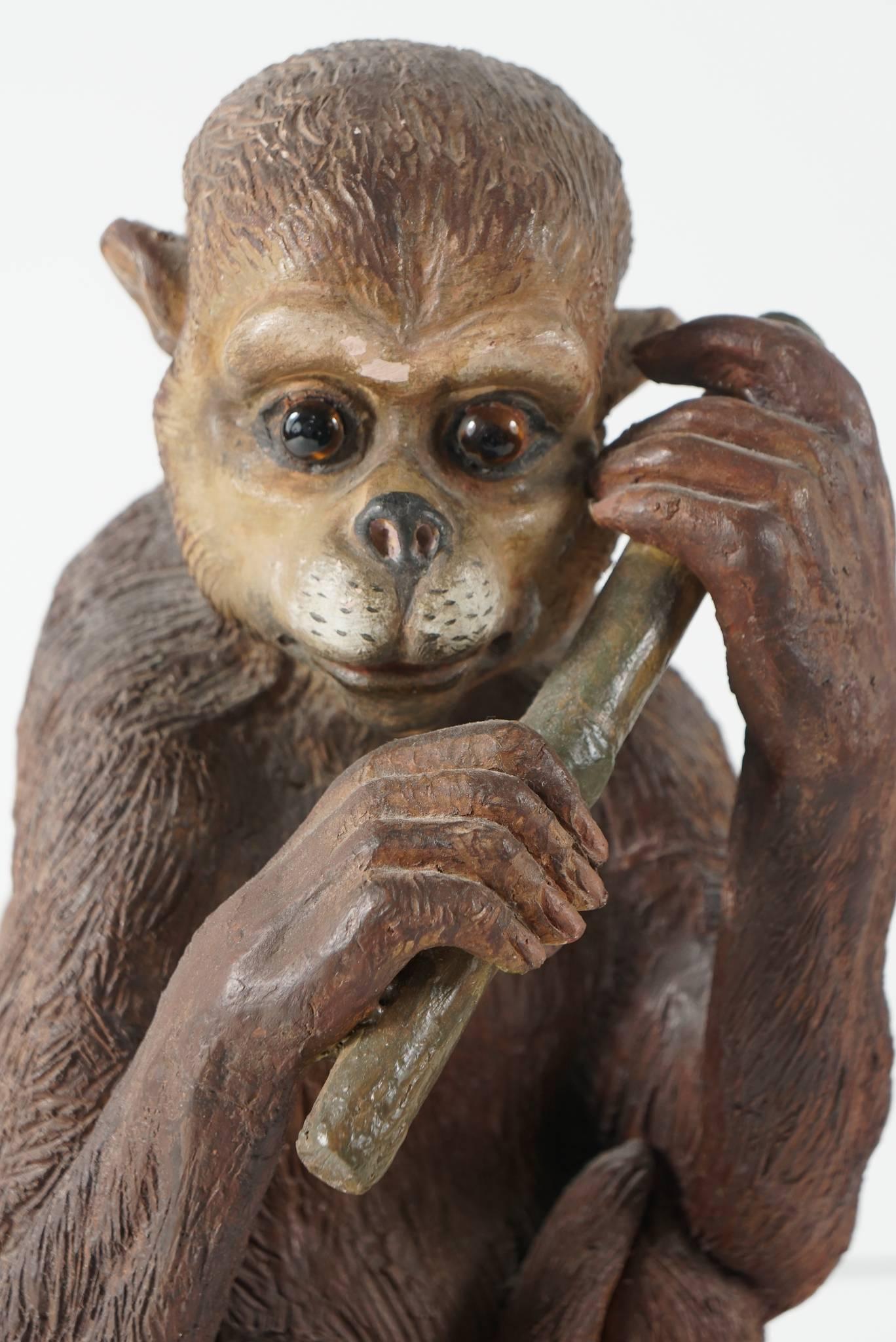 This fun and whimsical sculpture of a spider monkey is from France and was made in the mid to late 19th century. Pugs, bull dogs and sometimes Spaniels are seen in this form of work rarely are monkeys or birds portrayed in terracotta. Hand-formed