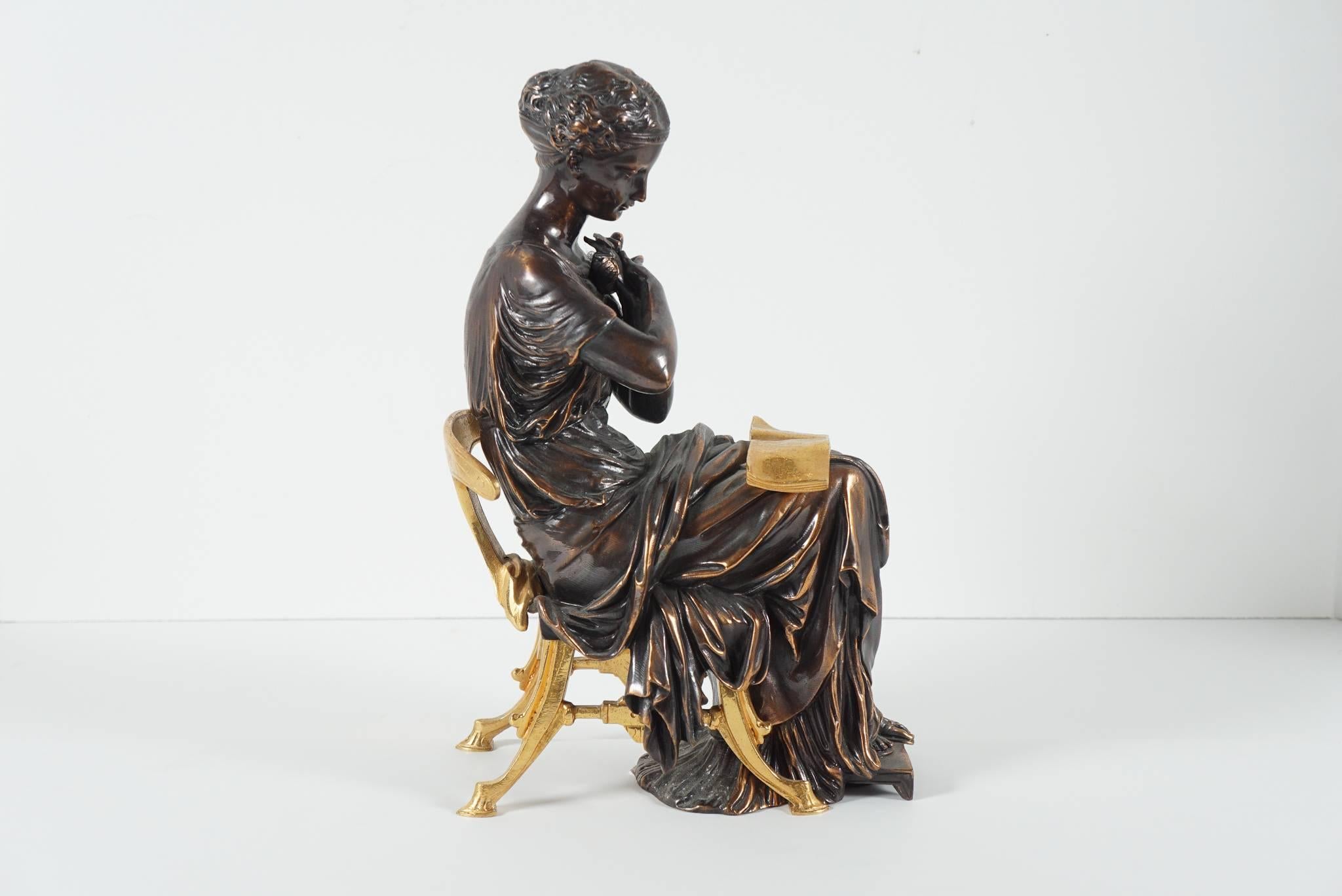 This finely cast bronze figure is French and was produced during the Aesthetic Movement period, circa 1880. The female figure classically draped and with a simple Grecian hairstyle sits upon a very finely cast and chased klismos chair. While reading