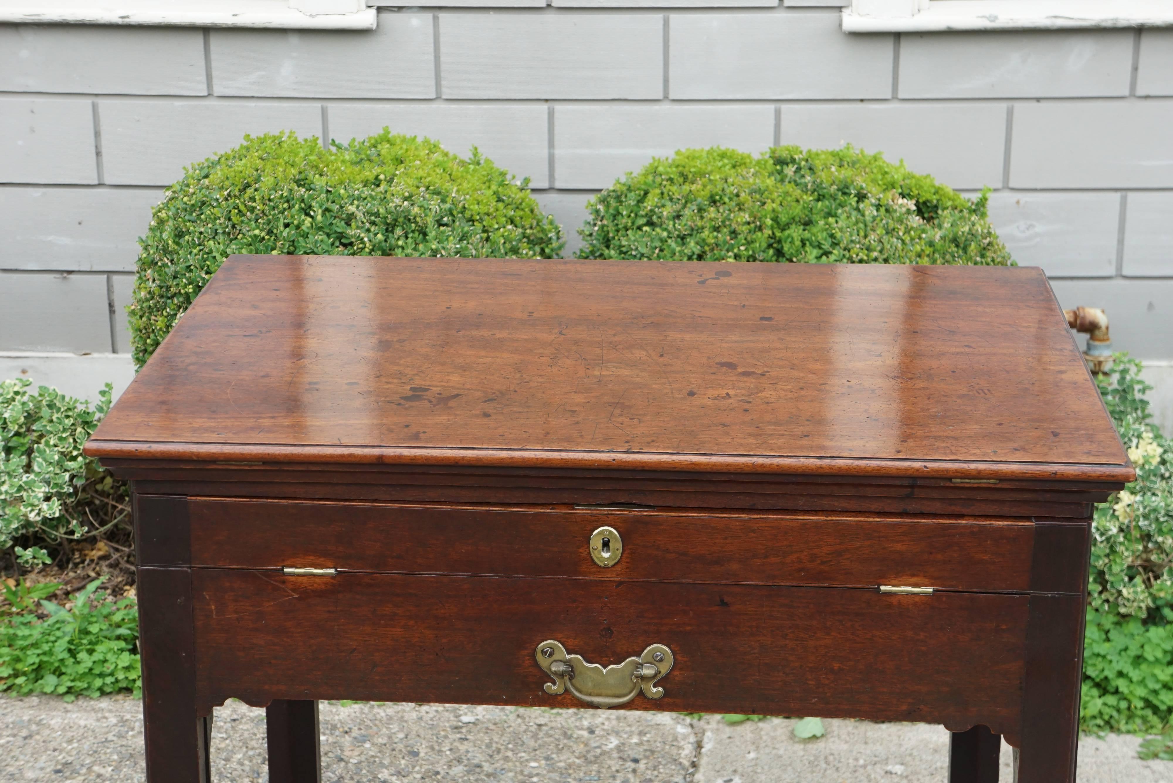 This fine period architects table was made in England, circa 1760 to 1770. Crafted from imported mahogany this was a costly and impressive form of furniture for a gentleman architect working in the country of a fashionable society interested in art,