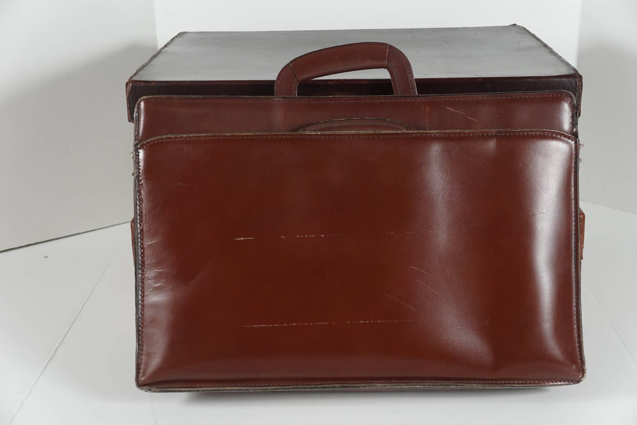 These fine vintage case all made before 1975 come from both Paul and Bunny Mellon. Two are small travel cases while the third is a valise. One case is marked “H. Maxwell ,Bond Street, London” and contains several pouch compartments and some personal