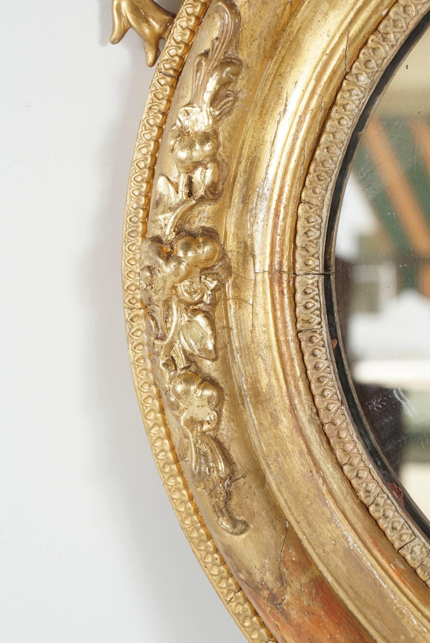 Victorian Oval Gilded Rococo Revival Mirror In Good Condition For Sale In Hudson, NY