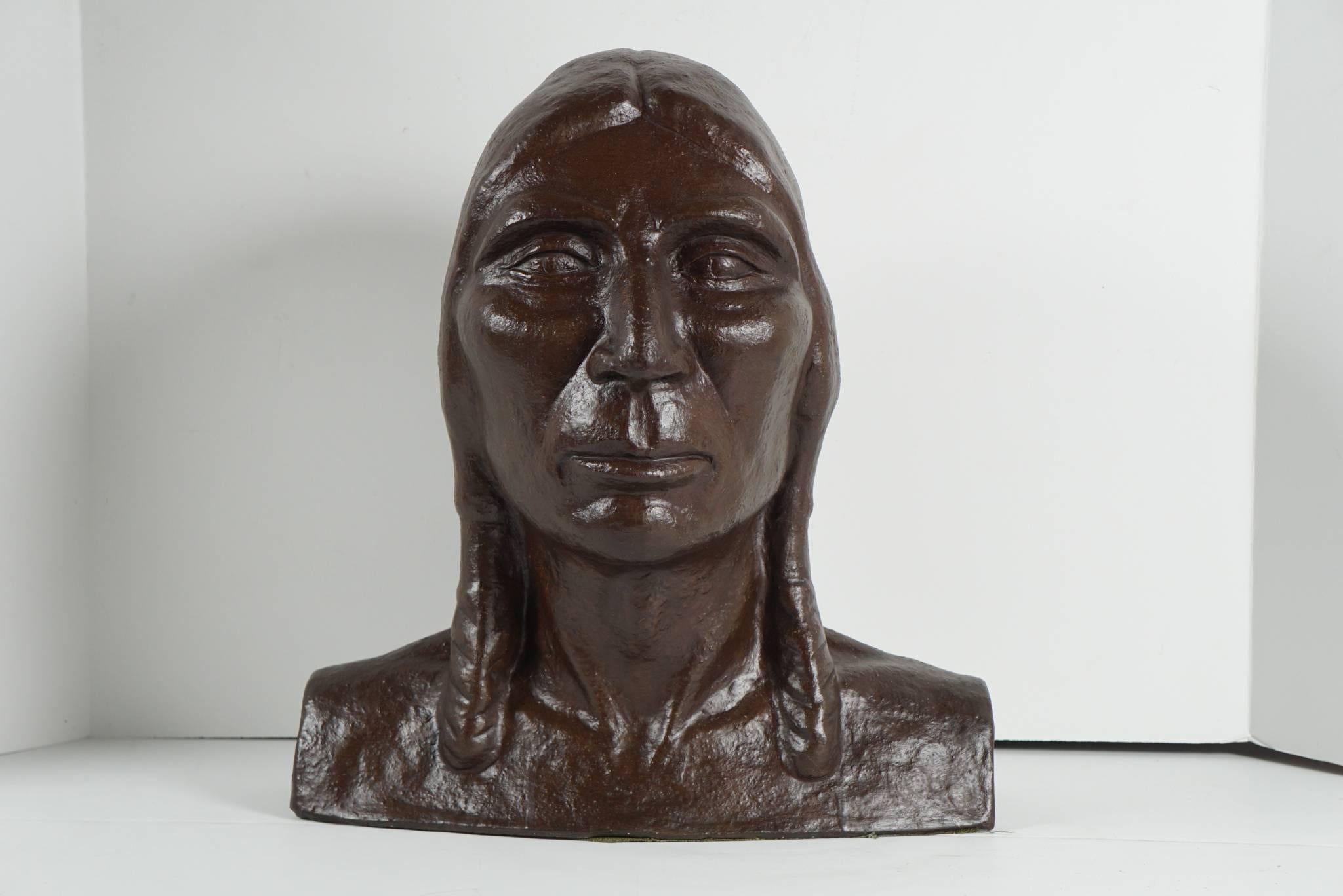 Created circa 1915 this work in bronzed plaster is from the school of art dealing with the diminishing culture of Native Americans as witnessed by European schooled painters and sculptures in the American southwest. Hand molded and sensitive to that