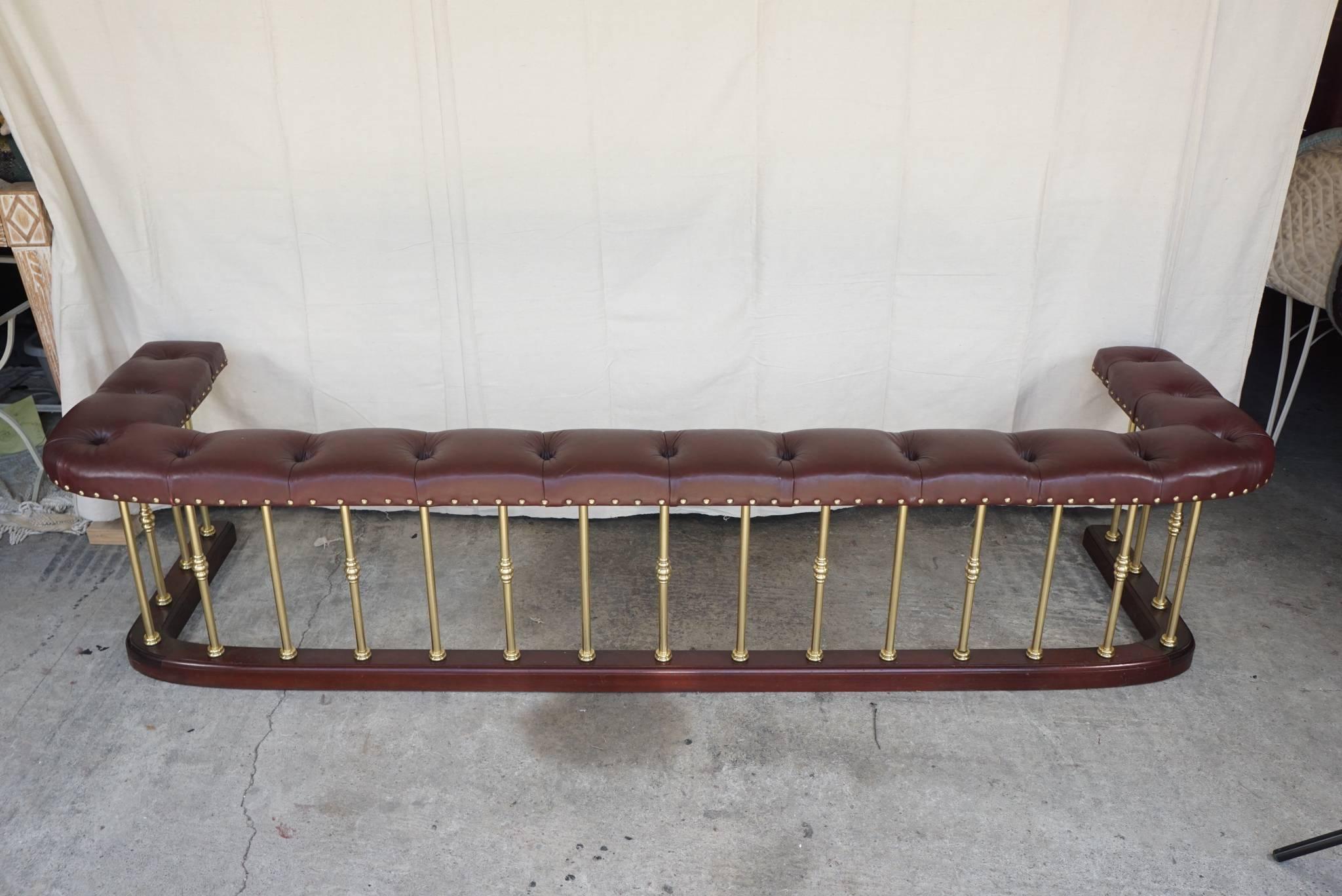 This large vintage fender made circa 1970 is well made, heavy and using solid brass, mahogany and top grain cow hides. Placed by Nina Campbell, the well known English decorator, in an American client's home the fender has been used and loved ever