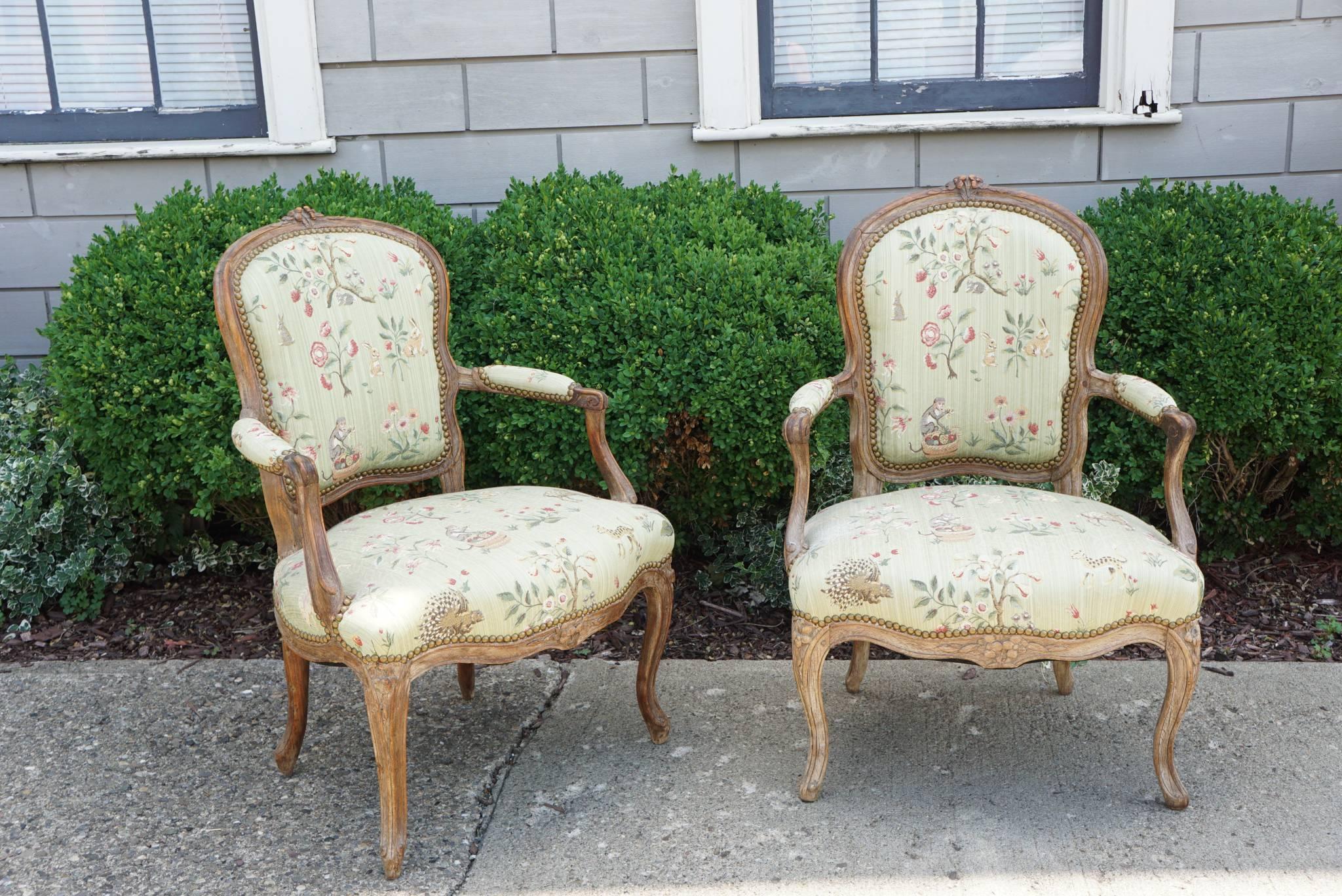 This lovely pair of period chairs circa 1750-1760 were made in France during the reign of Louis XV. Light and fun these small-scale chairs are comfortable and well crafted. The lessening of rigid formality at court demanded many new forms and