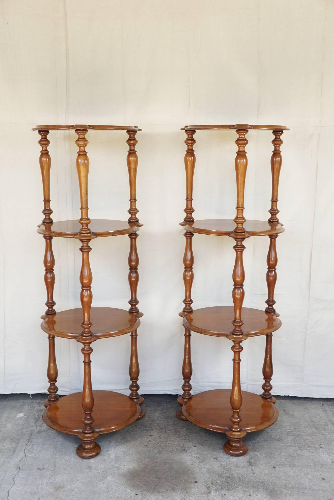 Unusual pair of étagères, made circa 1845-1850 in England in a round form are masculine and formal but not fussy or over decorated. The Mahogany color is warm and light not a deep red as is so often found. The finish is original and mellow but with