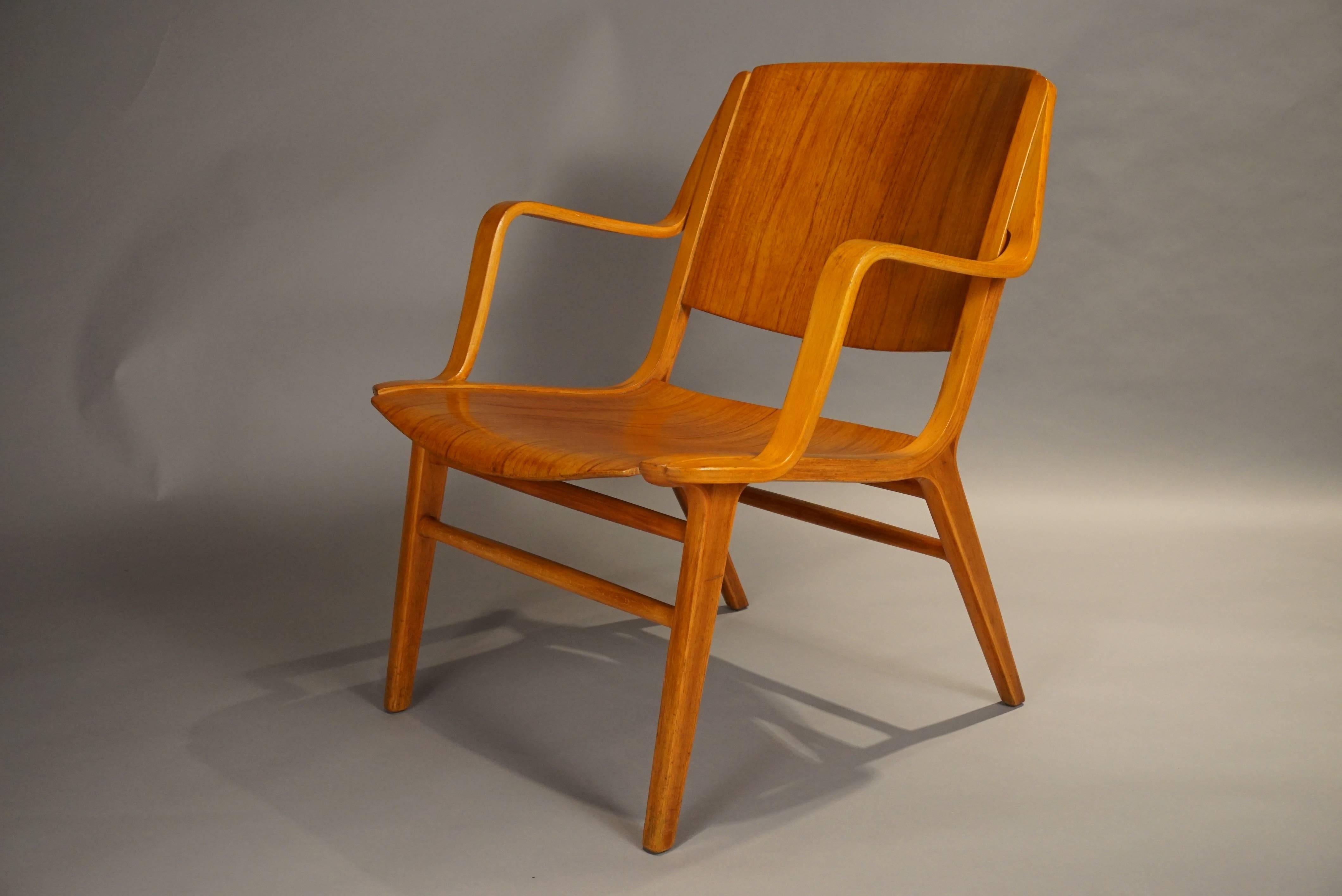 A Classic Danish chair. The chairs are made of beechwood and dark teakwood. Newly polished with a lustrous finish.
