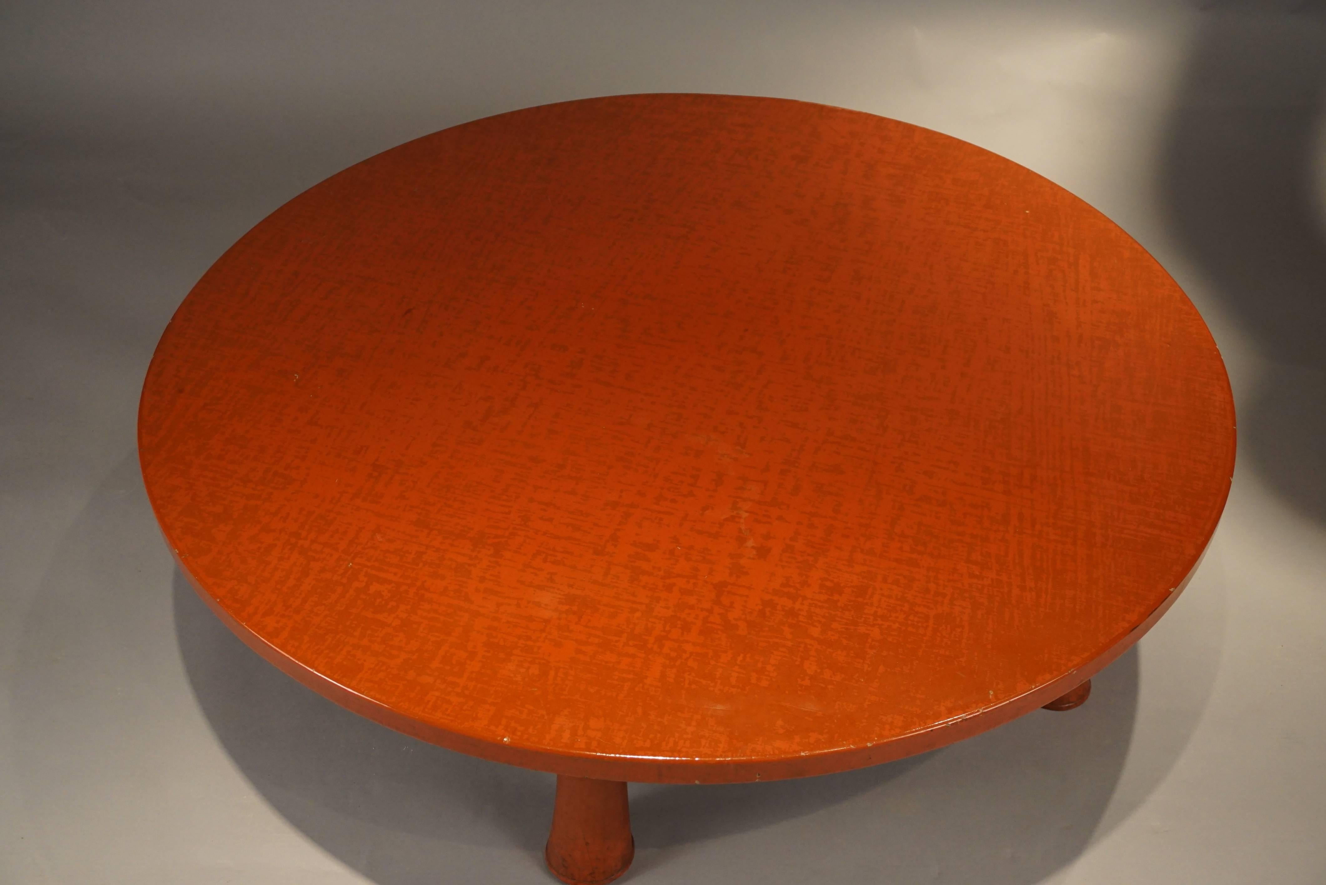 Asian inspired with Mid-Century Modern roots. Beautiful orange/red lacquer.
Large in scale with a 48 inch diameter top. The five legs create sturdy support
allowing the table to be used as a bench.