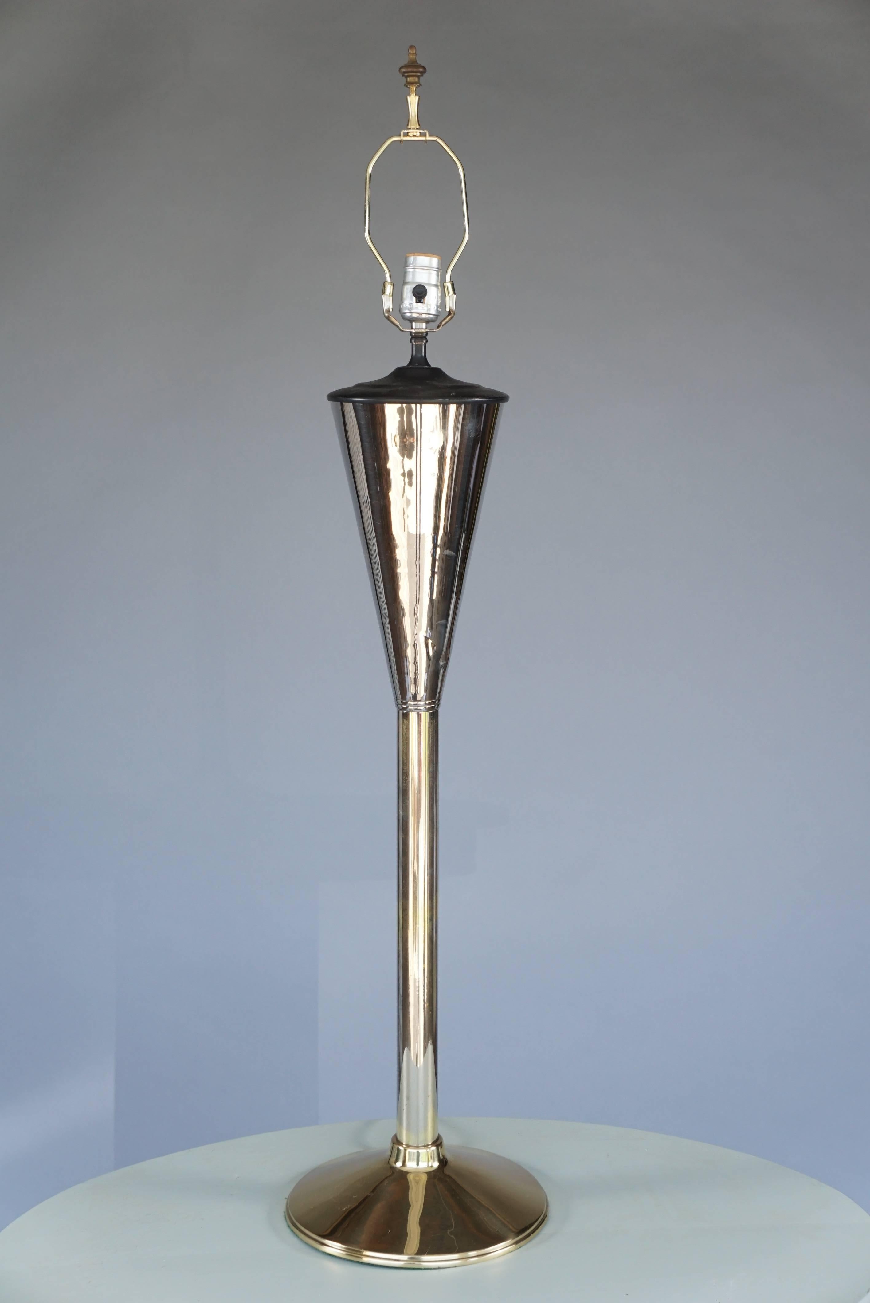 Beautifully elongated table lamps brass and polished metals
handcrafted. One of a kind.