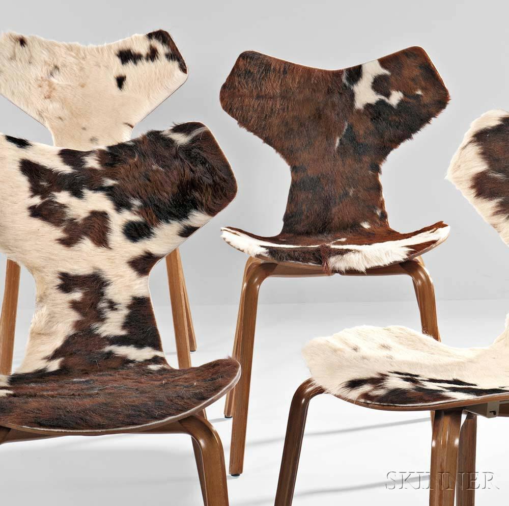 Classic Jacobsen chairs covered in cow skin.
Laminated teak seat with applied fur covering on raised wooden legs.
Manufacturers label and date.
         