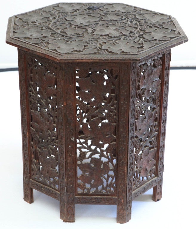 Well carved octagonal rosewood with grape leaf design.  Top has been securely afixed on but originally, usual two-piece folding design.