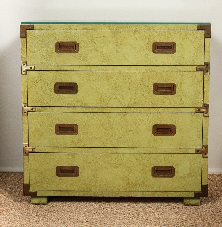 Four-drawer chest with brass handles pulls and detail.