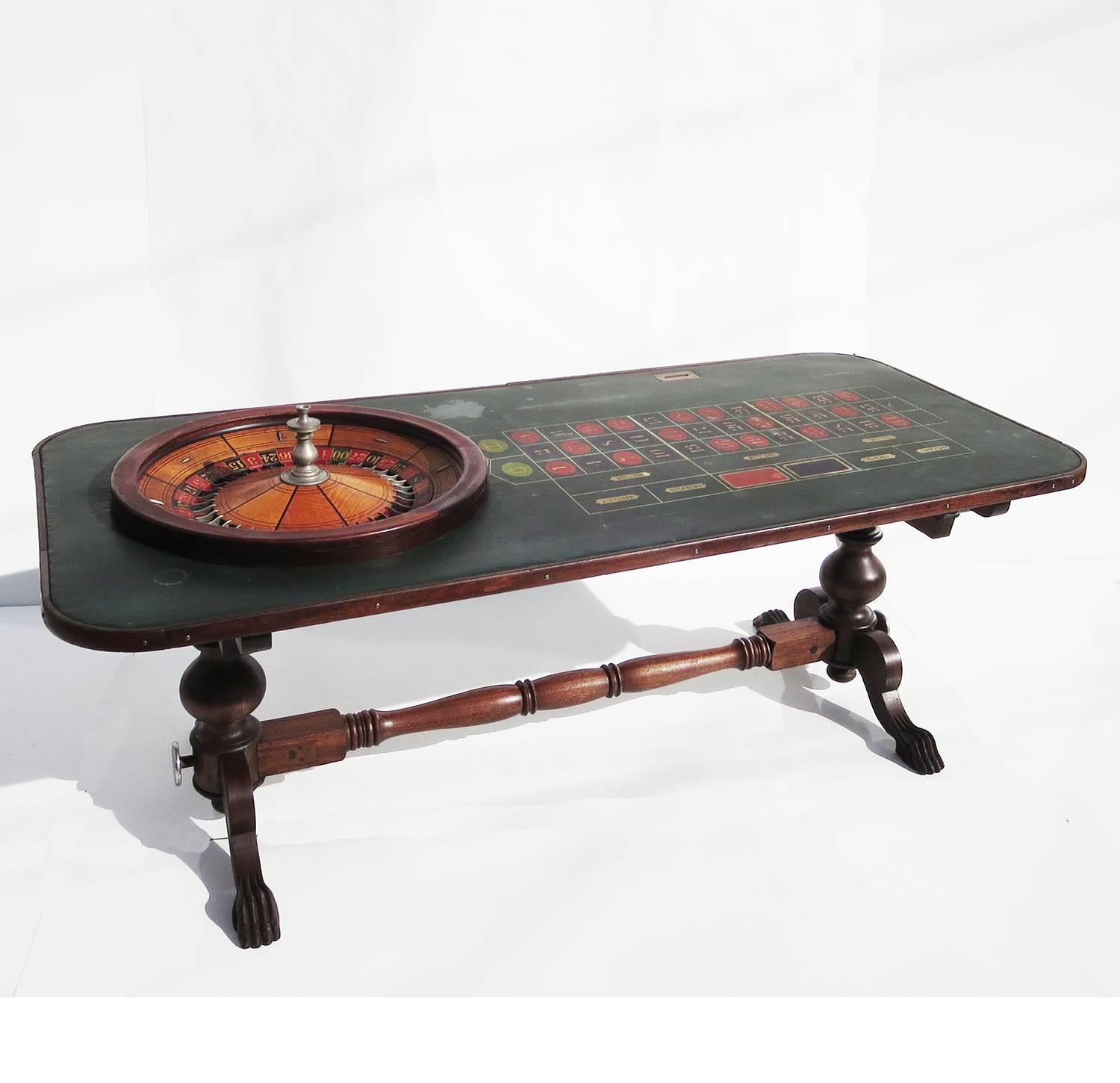 A fantastic example of an American turn of the century roulette table. Made by F. Grote and Co. of New York, the table features a very fine wheel of maple and rosewood, with a silvered center shaft. The playing surface is original oil cloth, rather