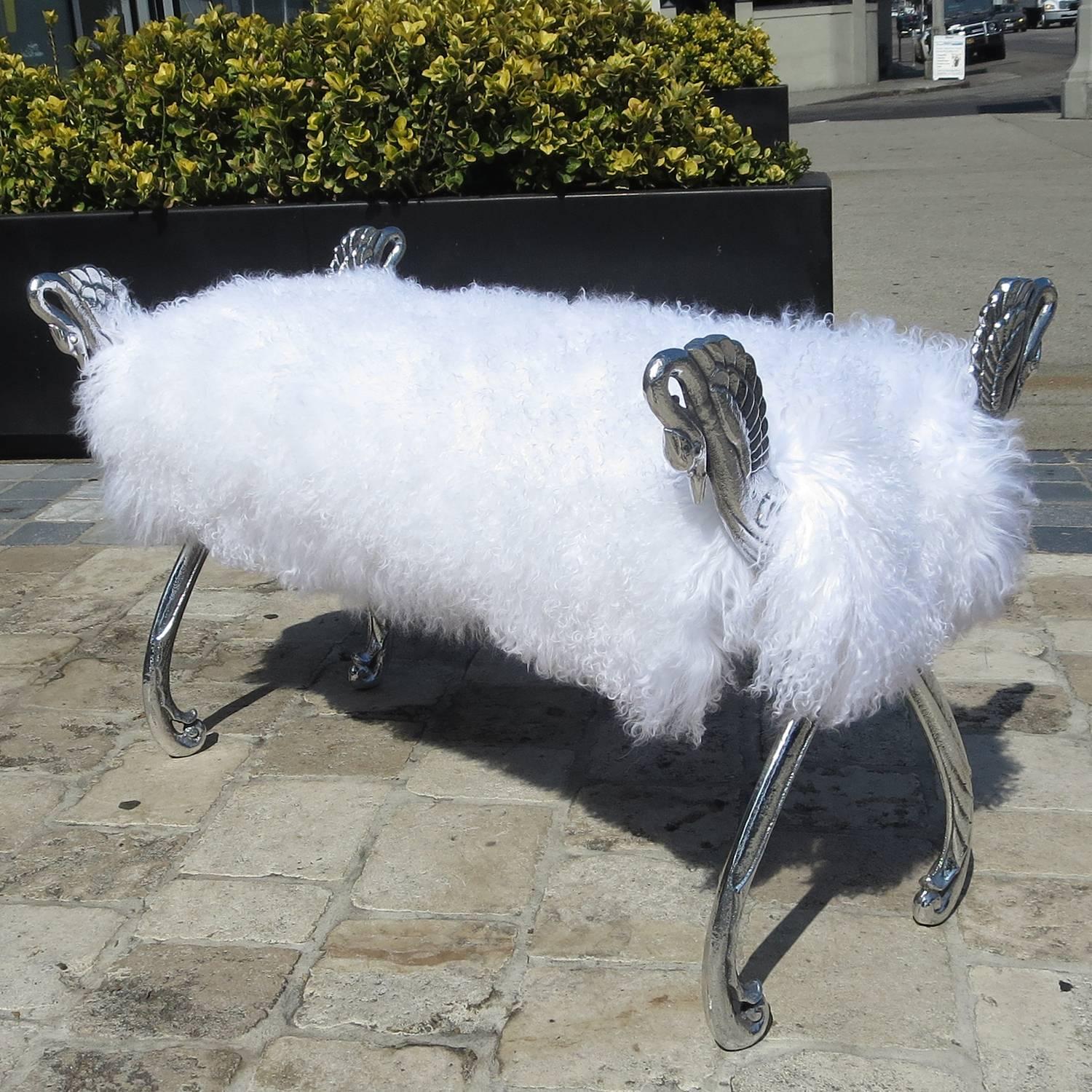 Fantasy furniture at its' finest! We have polished the aluminum swan arms to a high sheen, and reupholstered the bench in a silky soft sheep fur. The finished bench should add the right touch of glamour to any room!