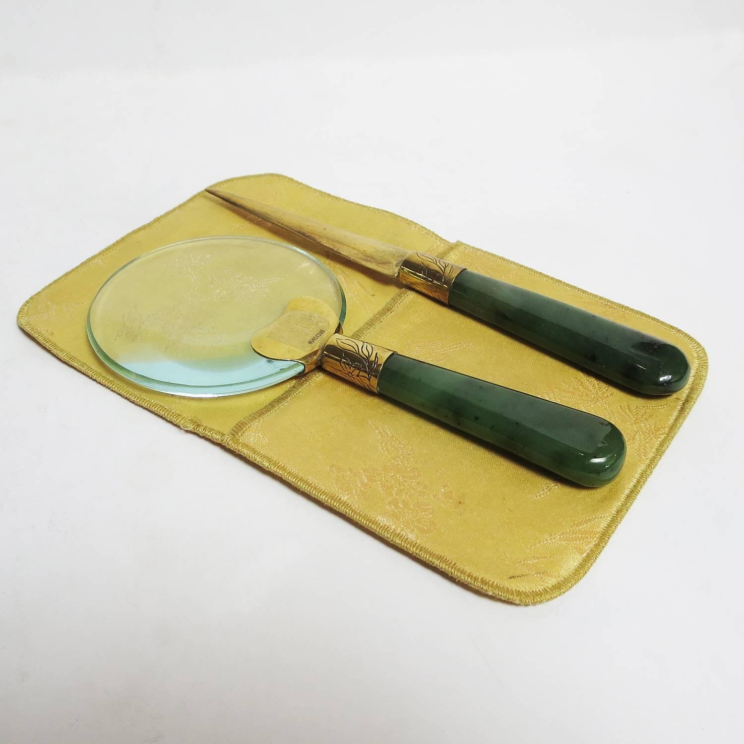 This charming set was made for and sold by Gumps store in San Francisco in the 1960's. The set consists of a glass magnifier and a letter opener, set in a Chinese silk envelope. Both are marked Hong Kong, and Gumps on the opener.