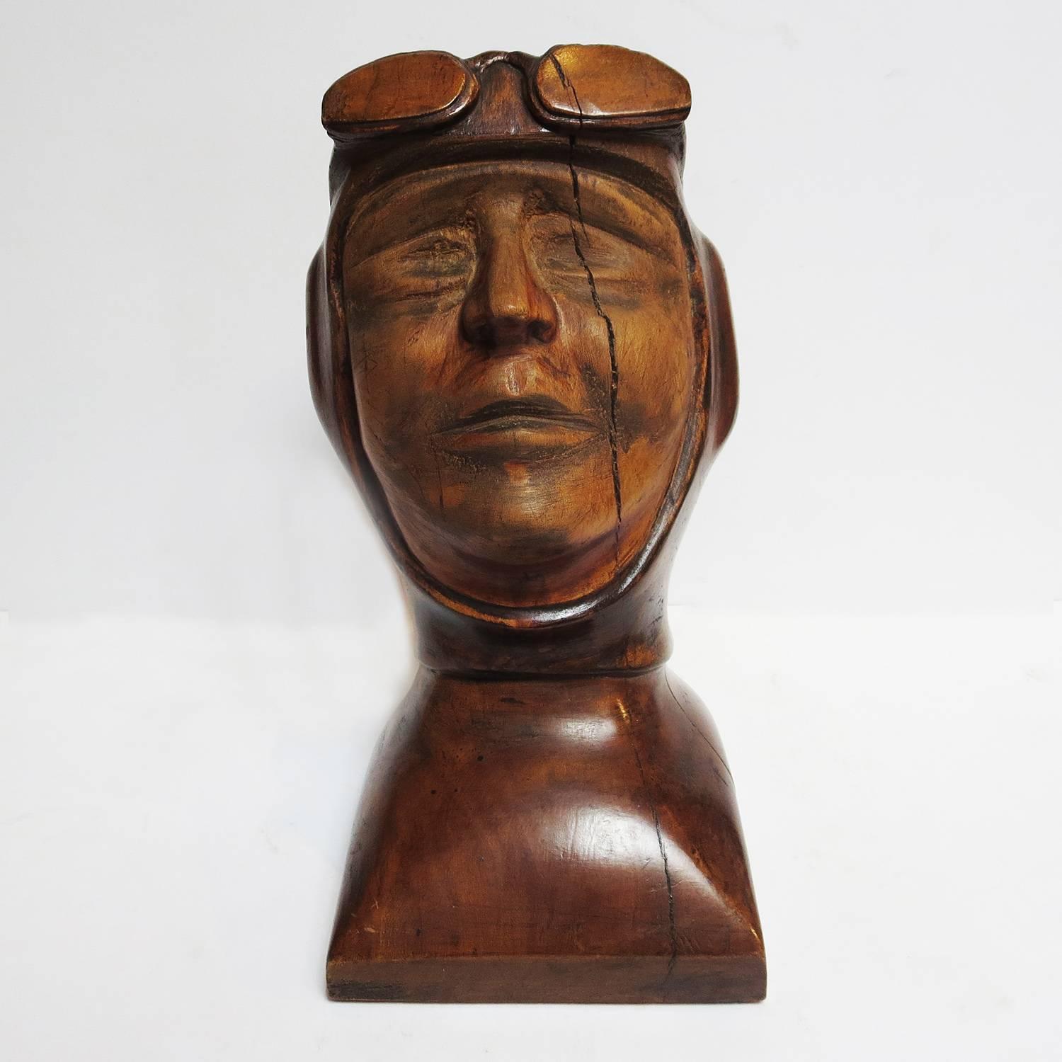 This wonderful bust is unsigned, but the artist was obviously highly skilled. The aviator is tilted back, perhaps in a 
