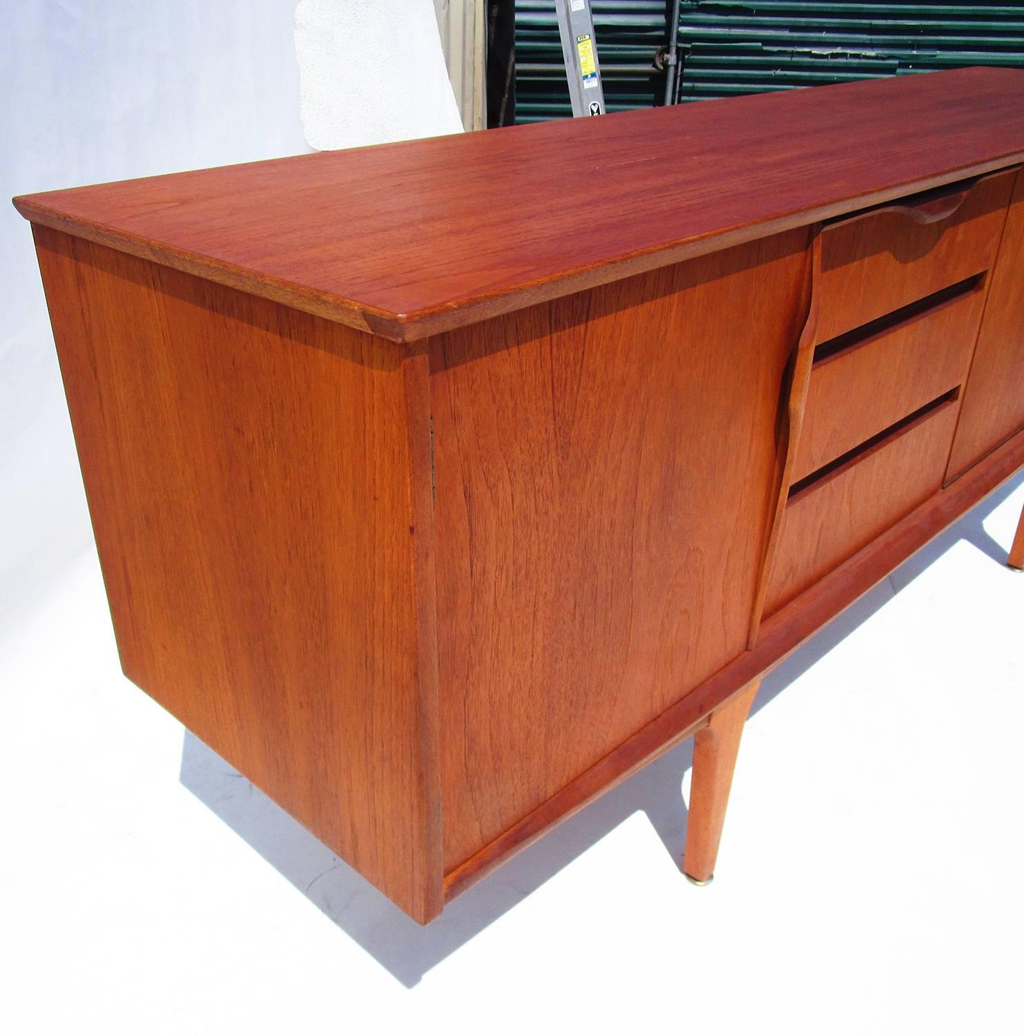 A Classic and clean design featuring tree drawers and three cabinet spaces for storage. Nice original condition.