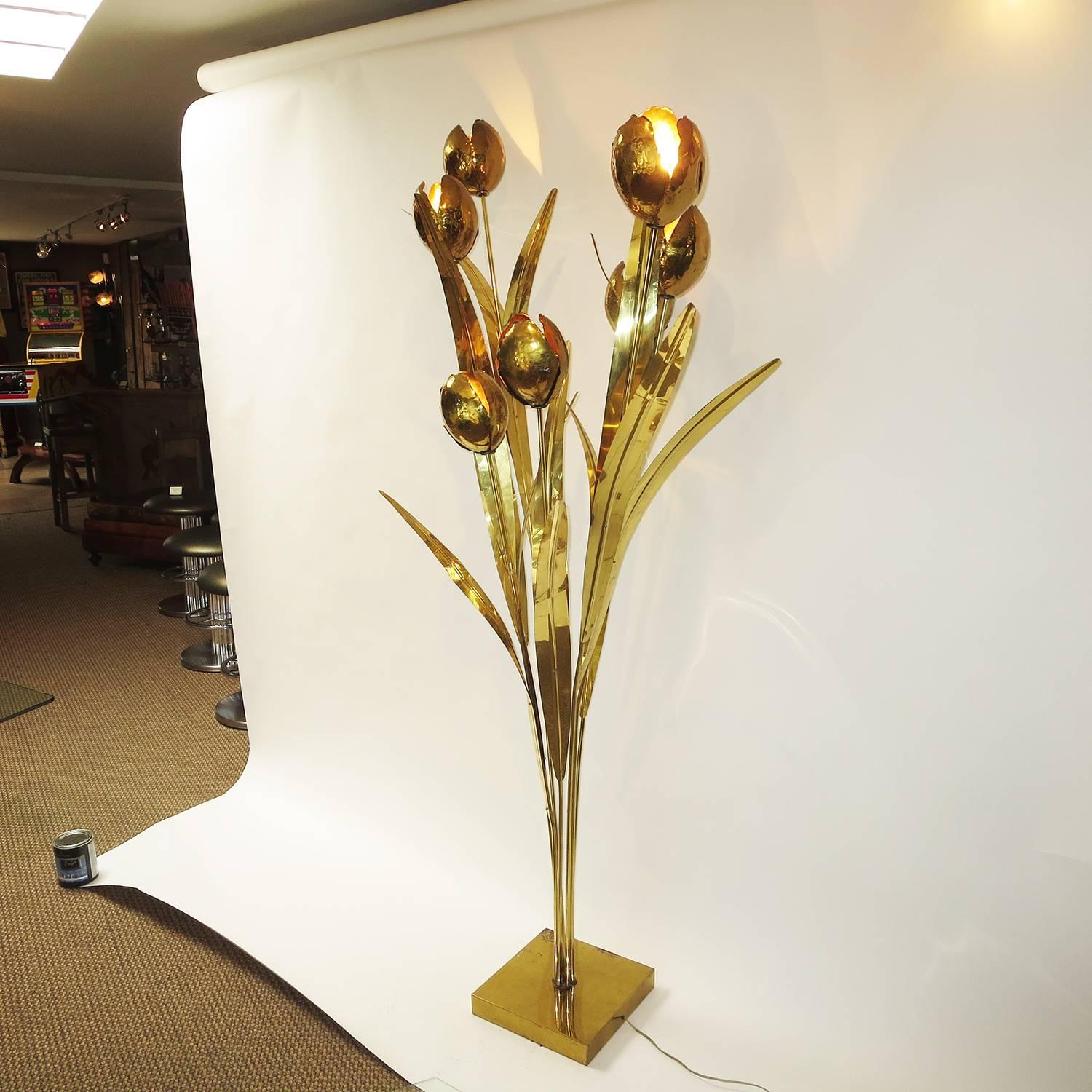 A lovely lamp featuring solid brass flowers and leaves radiating from seven brass 