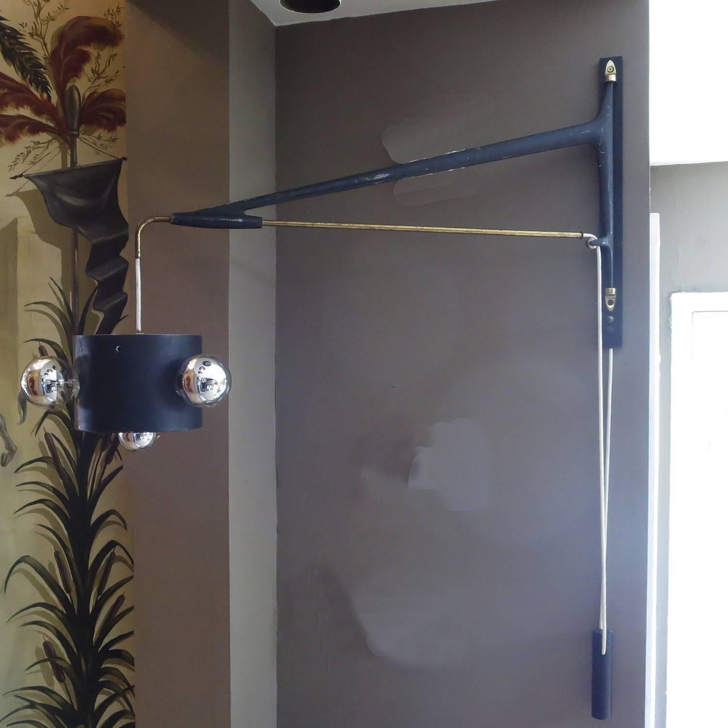 RETIREMENT SALE!!!  EVERYTHING MUST GO - CHECK OUT OUR OTHER ITEMS.				

A great design by the French master lighting designer, Maison Arlus. The swing arm is painted cast aluminum, with brass accents. A solid counter weight allows one to regulate