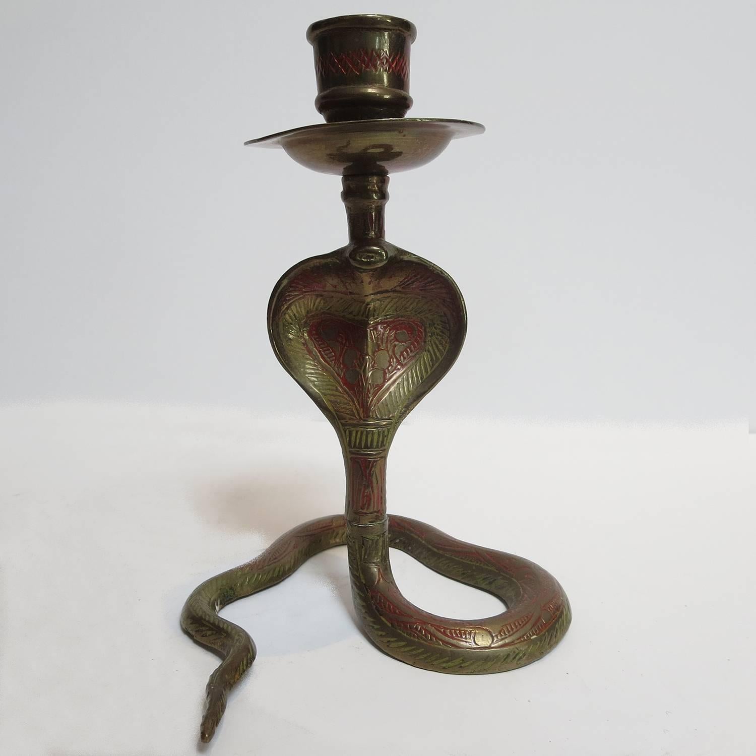 These charming cobra snake candlesticks are sure to add an exotic touch to any decor! The brass has been hand chase hammered, and hand painted. Both are in excellent original condition, and display a lovely patina.