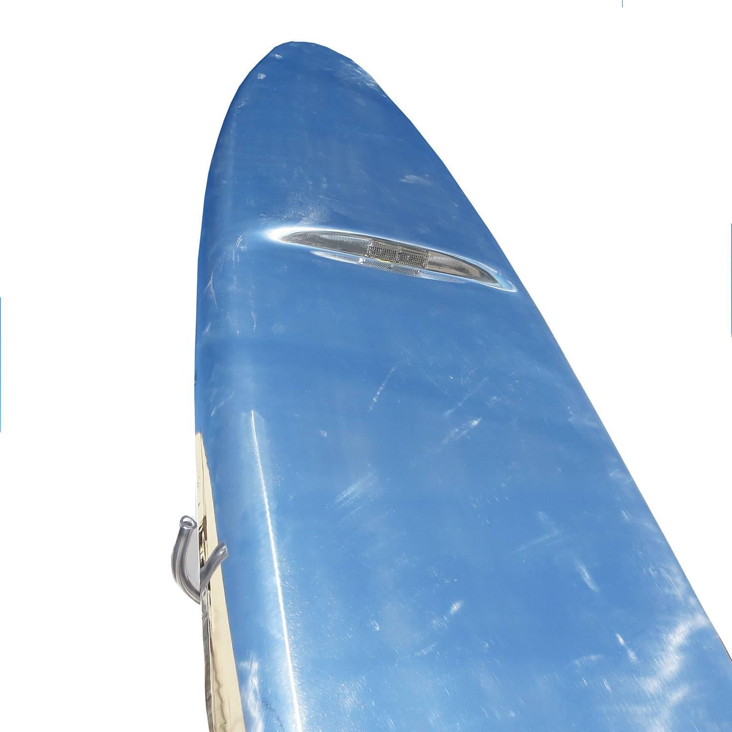 Produced from 1965 to 1968, the jet board was the design of a former Boeing Aviation engineer. The aluminum surfboard is powered by a 6.25 horsepower Tecumseh engine and jet propulsion system. Air is vented through the front of the board and