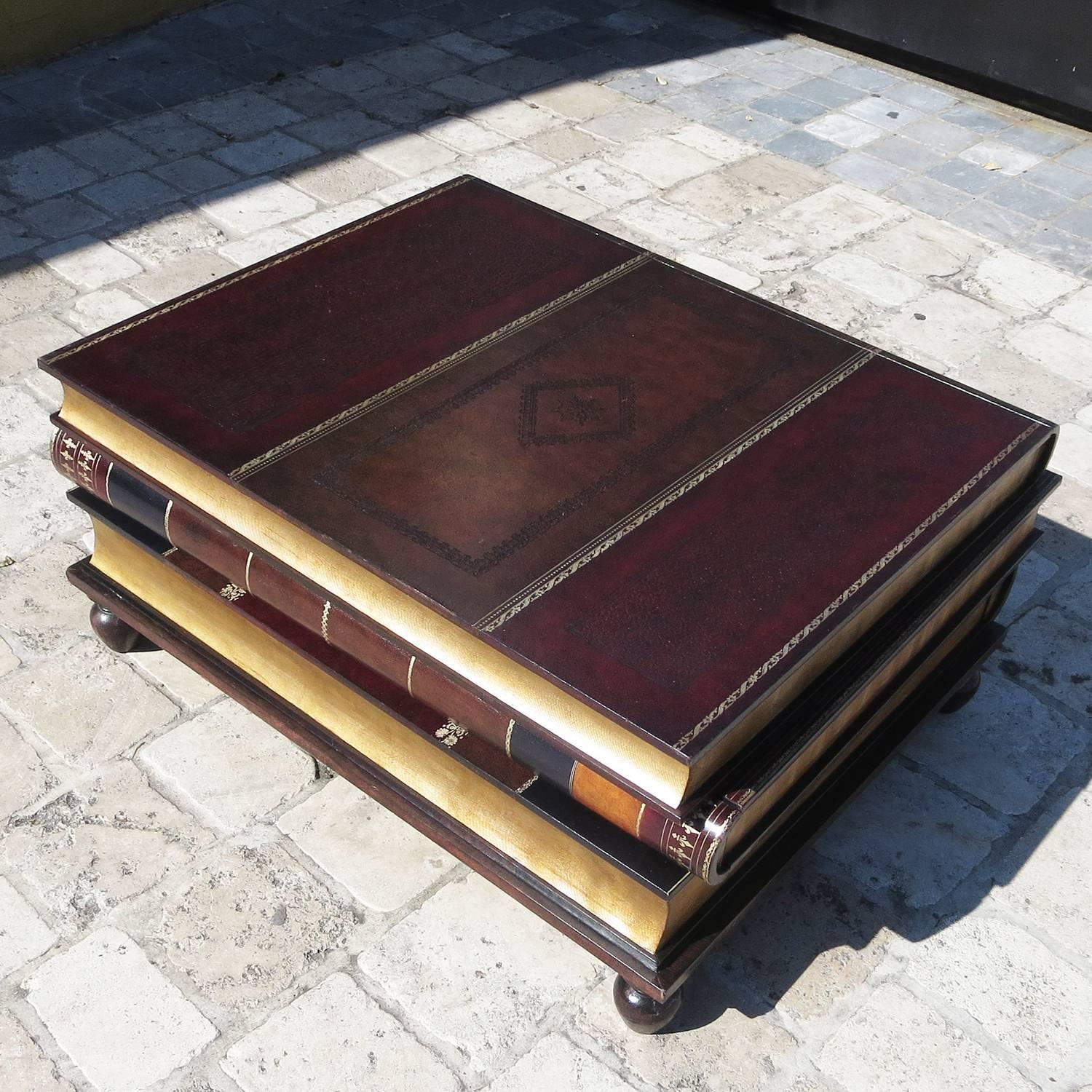 The perfect centerpiece for that library! These serious looking volumes are actually three drawers, stacked to the perfect coffee table height on four ball feet. Each drawer is lined with a faux Victorian wallpaper lining and are in very fine
